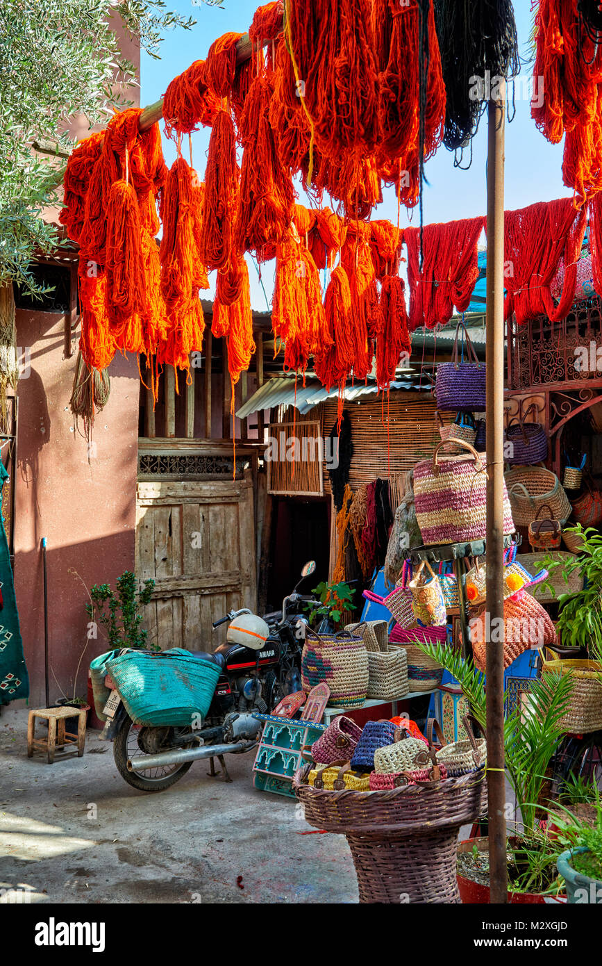 Brightly coloured wool hanging to dry in the dyers souk, textile souk ...