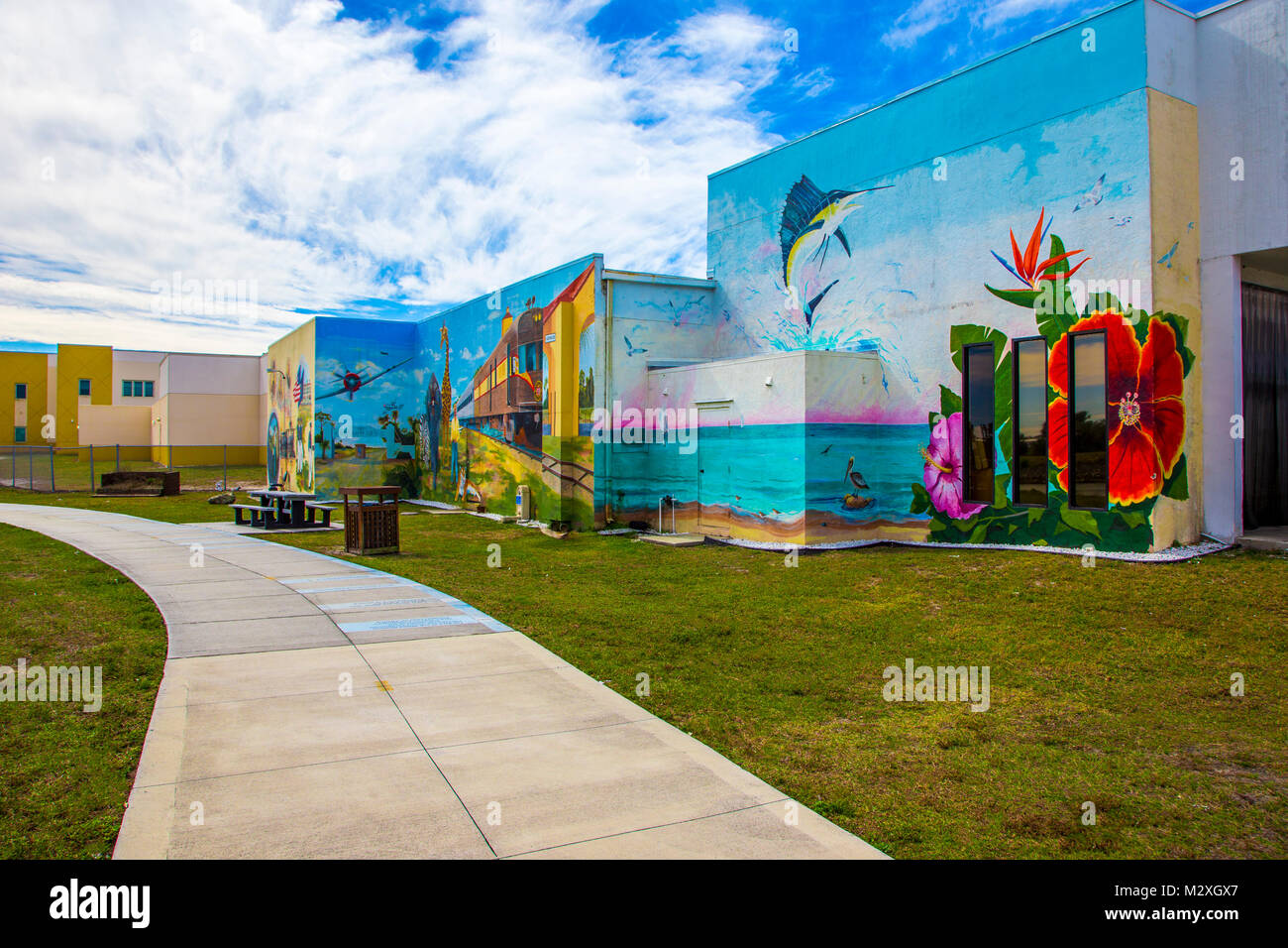 Murals on buildings along the Venice Waterway Park Trail along the