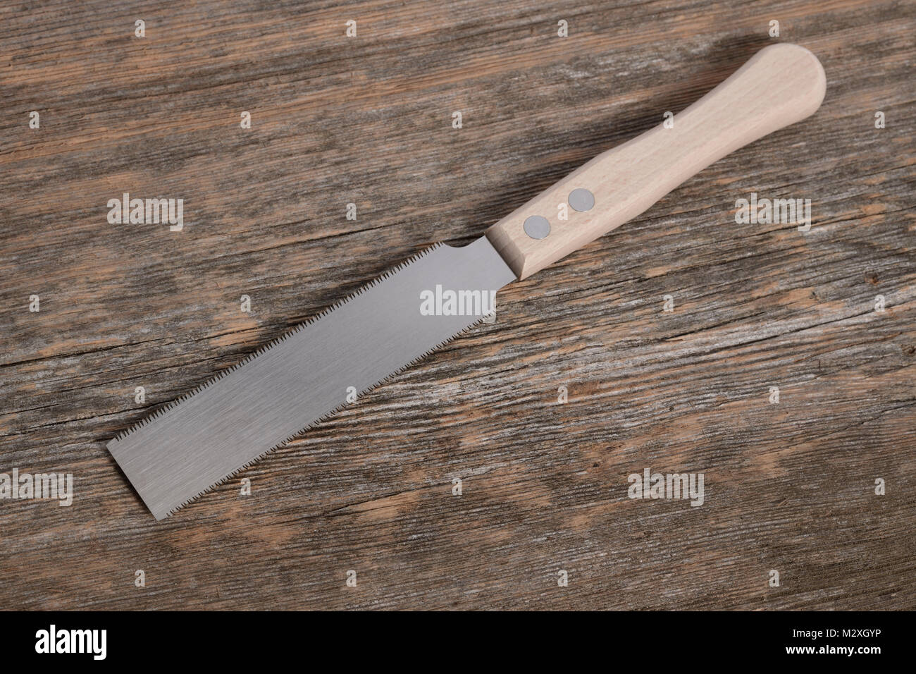 Kugihiki, Japanese flush cutting double edged wood hand saw, both, ripping and crosscut saw in one Stock Photo