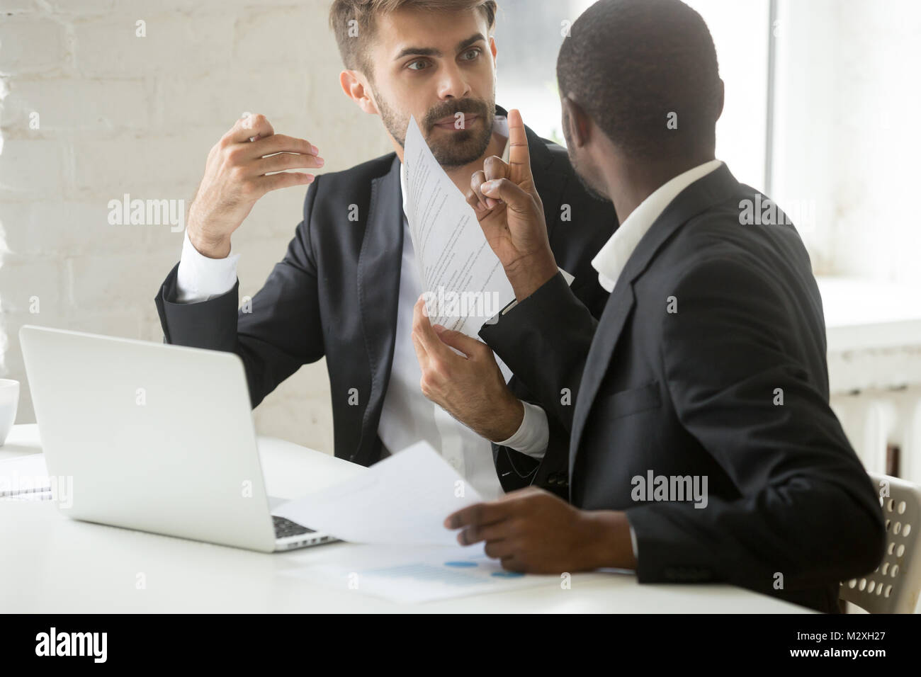 Multiracial african and caucasian partners arguing disagreeing a Stock ...