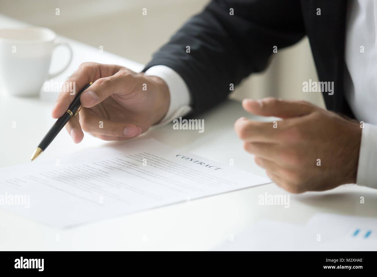 Businessman offering to sign business contract concept, close up Stock Photo