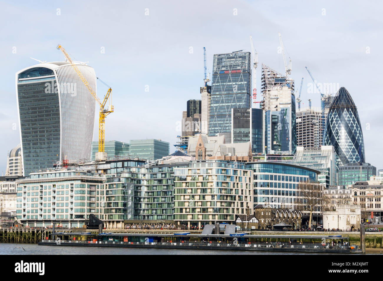 The dense commercial development of the City of London skyline seen across the River Thames. Stock Photo