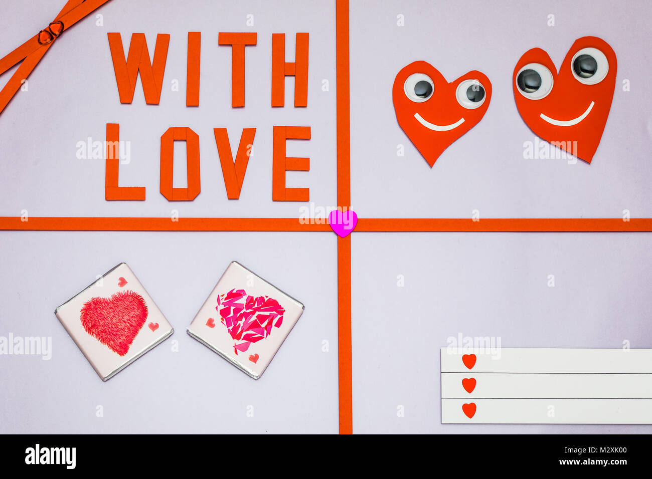 Greeting card 'Hearts with eyes + With Love' on colored background Stock Photo