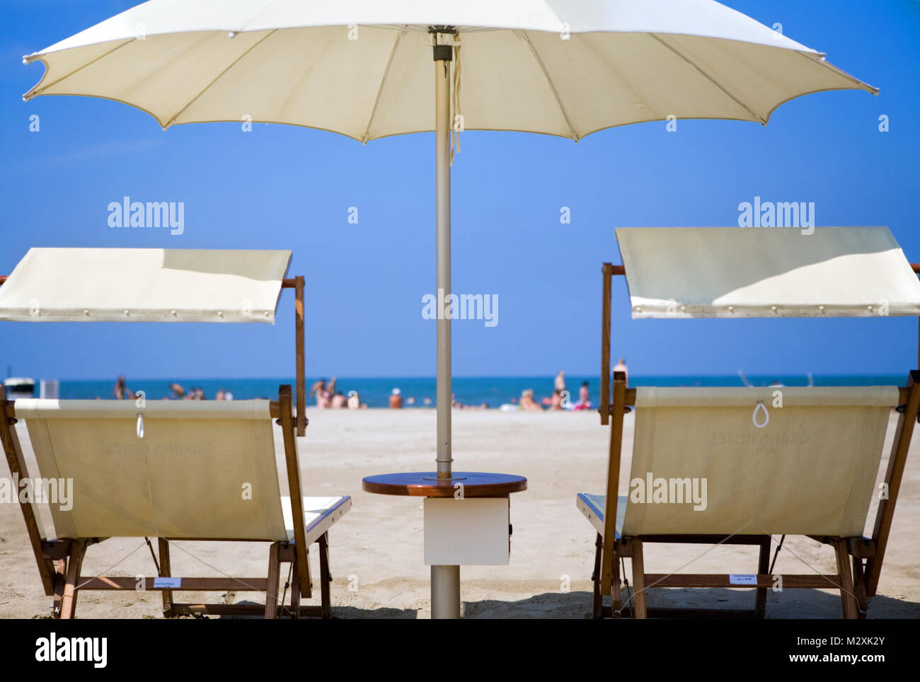 white parasols and sun loungers on a beach in Rimini, Emilia-Romagna, Italy  Stock Photo - Alamy