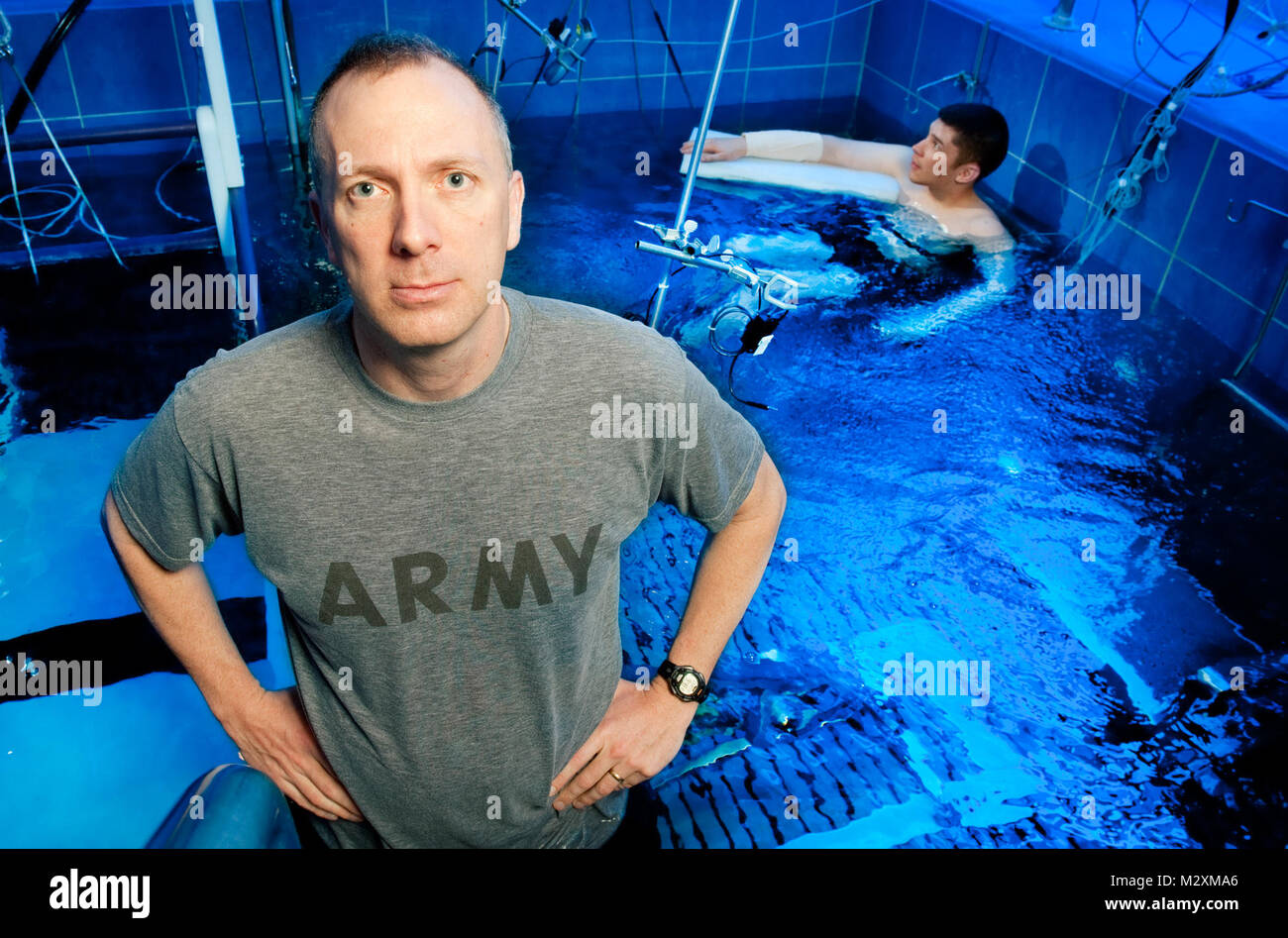 David Kamm/NSRDEC Photographer Capt. Dave DeGroot, Ph.D., puts volunteers into a water immersion tank at the U.S. Army Institute of Envrionmental Medicine at Natick Soldier Systems Center as part of a study that is looking at how Soldiers' bodies cool down. heal2 by MilitaryHealth Stock Photo
