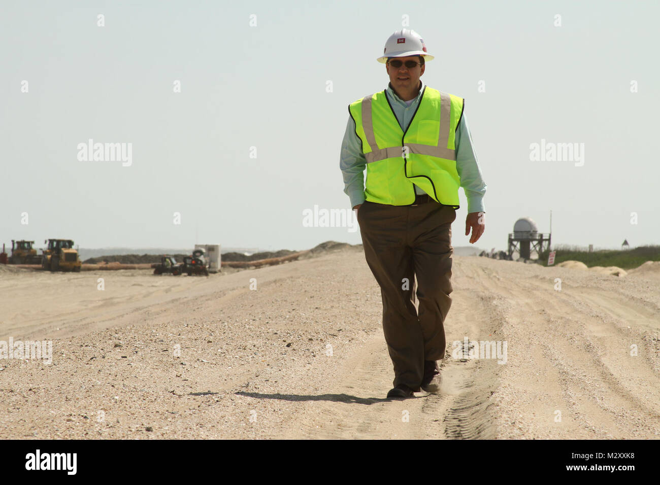 WALLOPS ISLAND, Va. – Mike Anderson, chief of the operations branch design section, walks along the newly built beach at the NASA Wallops Island Flight Facility here, May 7, 2012. The new beach will help protect more than $1 billion in federal government and Commonwealth of Virginia assets located here.  The Wallops Island facility is home to, not only NASA, but also the US Navy Surface Combat Systems Center and the Mid-Atlantic Regional Spaceport making this a growing economic generator for the Commonwealth of Virginia and the region. (U.S. Army photo/Patrick Bloodgood) 120507-A-OI229-036 by  Stock Photo