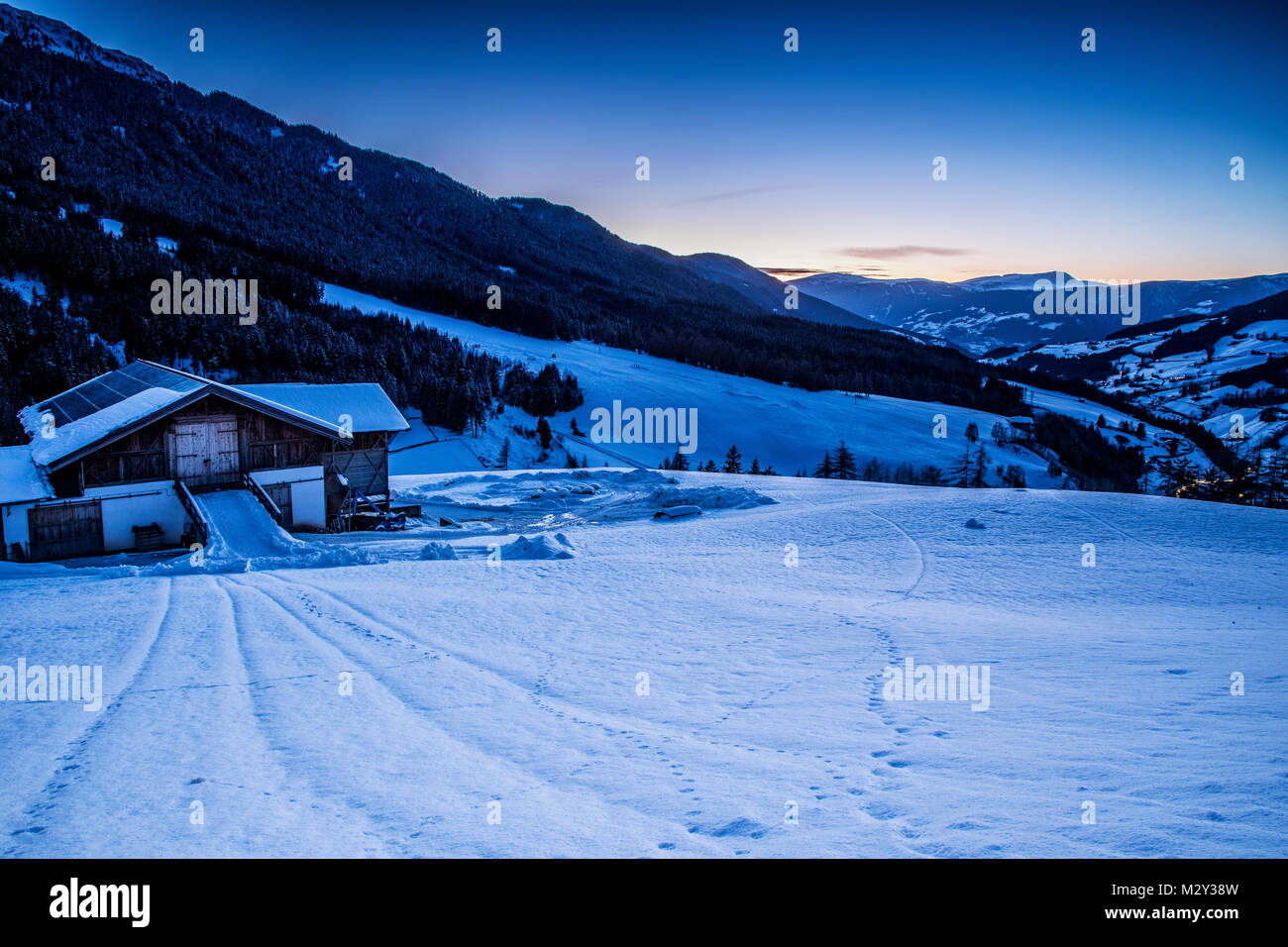 A view towards the village of Santa Maddalena, Province of Bolzano - South Tyrol, Italy on a winter evening Stock Photo