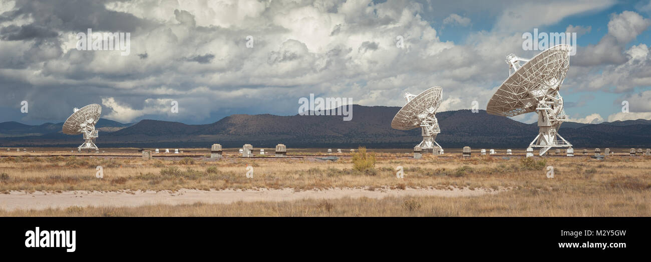 Very Large Array (VLA) Radio Telescopes with pronghorn antelopes in the foreground located at the NRAO Site in Socorro, New Mexico. Stock Photo