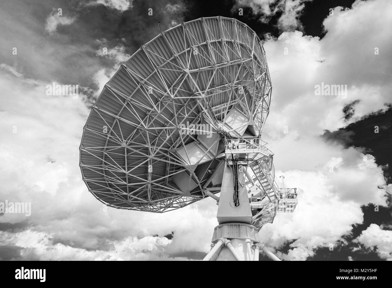 Black & White Photograph of a Very Large Array (VLA) Radio Telescope located at the National Radio Astronomy Observatory Site in Socorro, New Mexico. Stock Photo