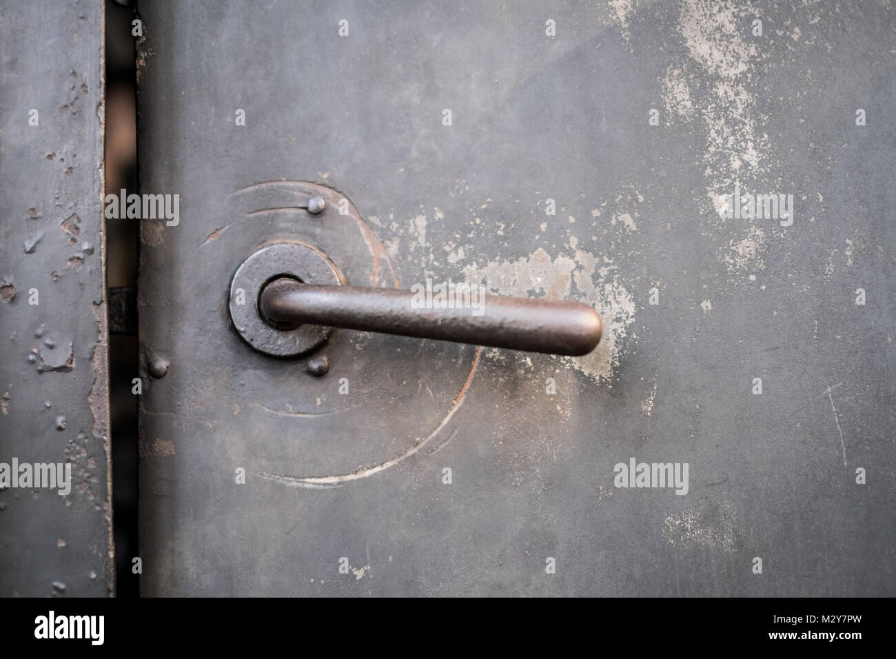 old metal door, iron door, vintage door handle   - Stock Photo