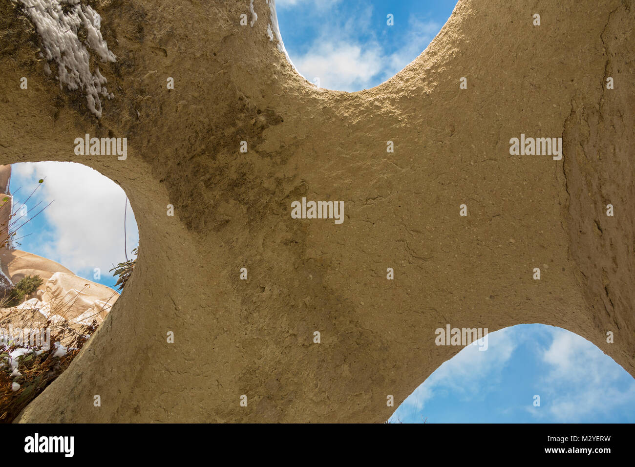 Limestone rock with tunneled hole Tunnel through the Limestone Western