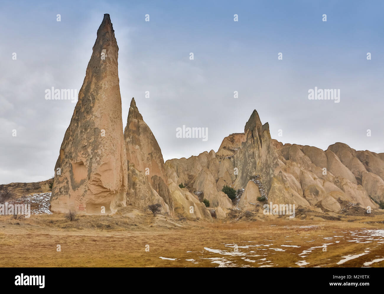 The sharp cones of rock formations boasts unique colors and shapes, Cappadocia, Turkey. Stock Photo