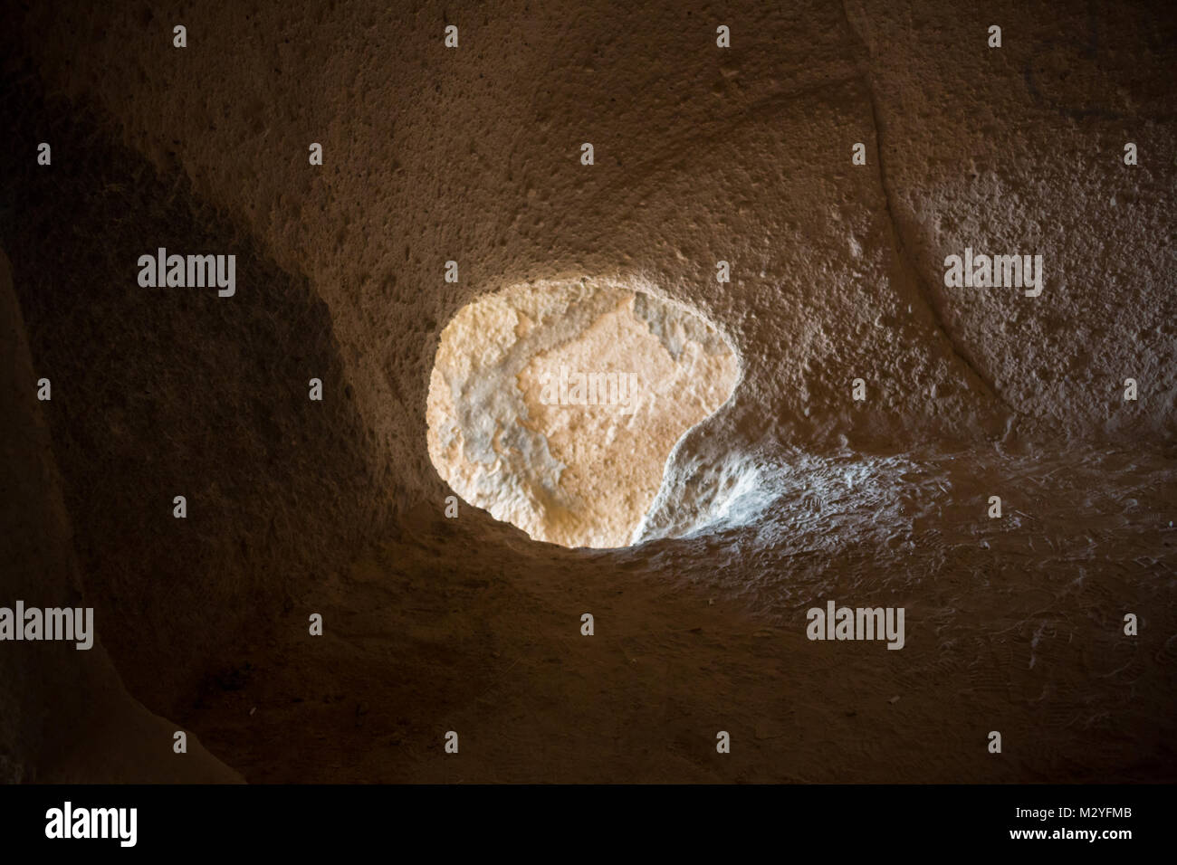 Limestone rock with tunneled hole Tunnel through the Limestone Western