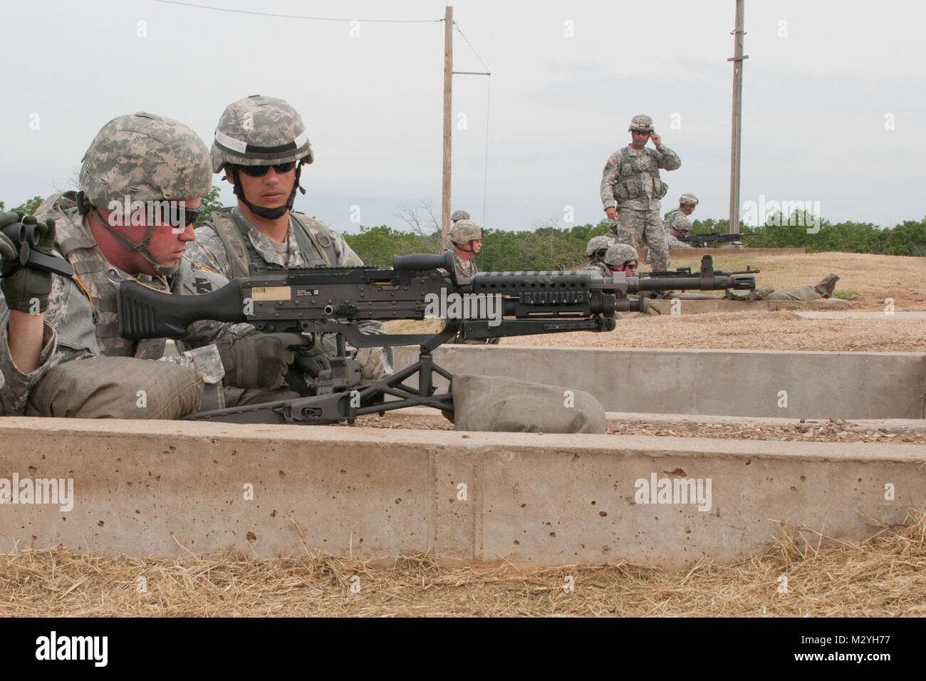 Spc. Brandt Crouch, [LEFT], a combat engineer with Headquarters and