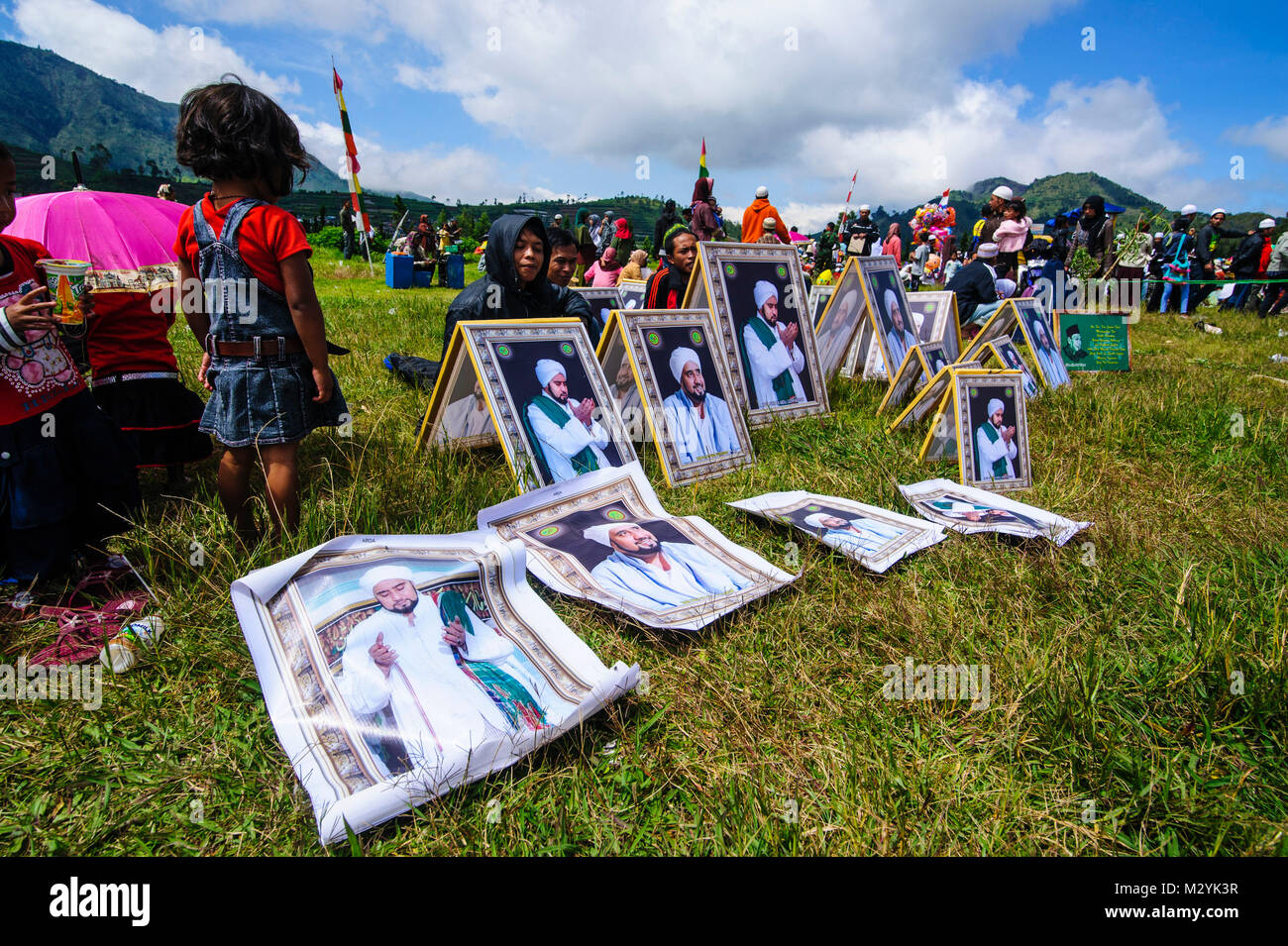 Muslim leader photos for sale at a Muslim festival at the Arjuna Hindu Dieng temple complex , Dieng Plateau, Java, Indonesia Stock Photo