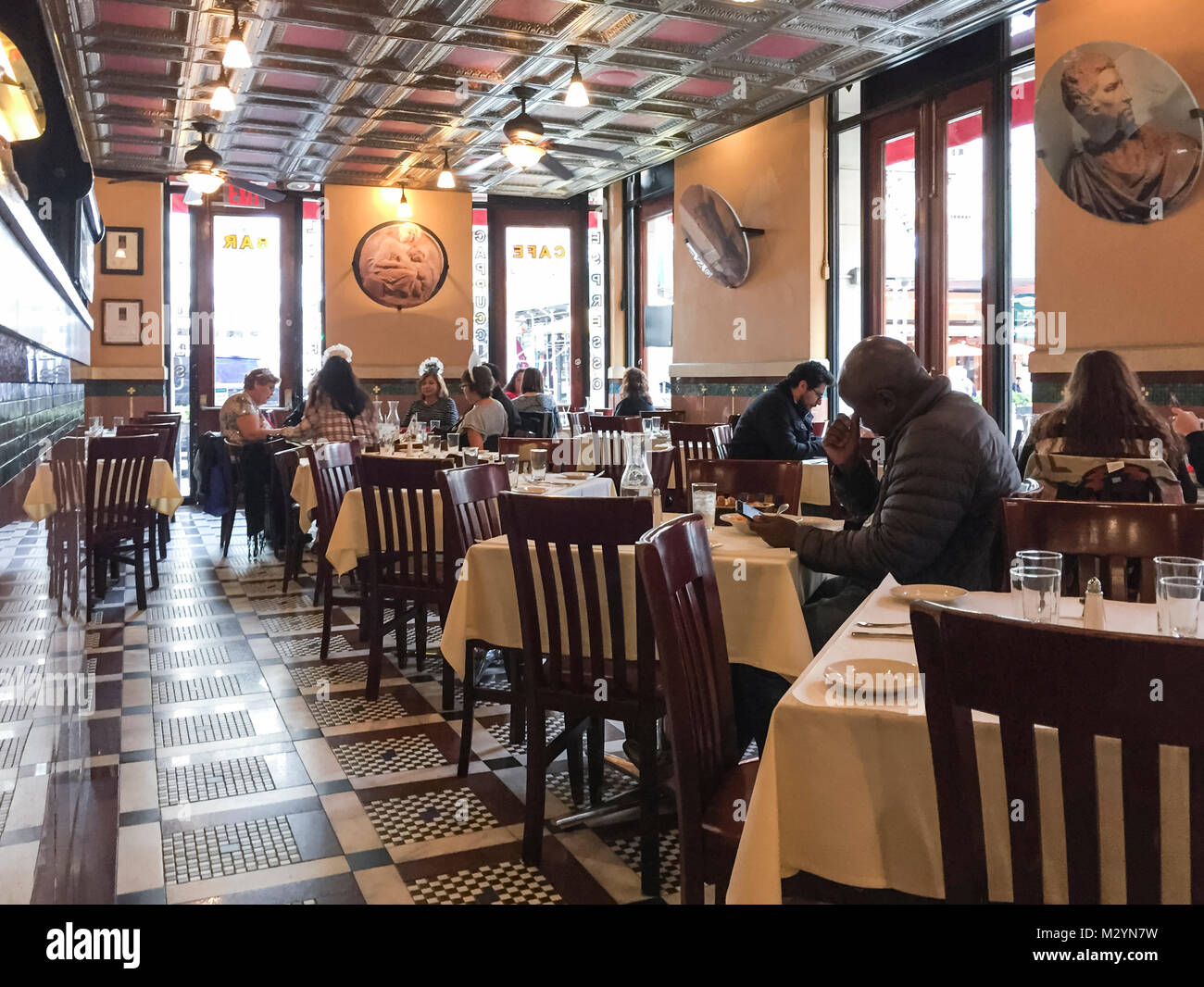 Interior of Grotto Azzurra in the Little Italy neighborhood, Manhattan, New York City. People dining out in traditional Italian restaurant. Stock Photo