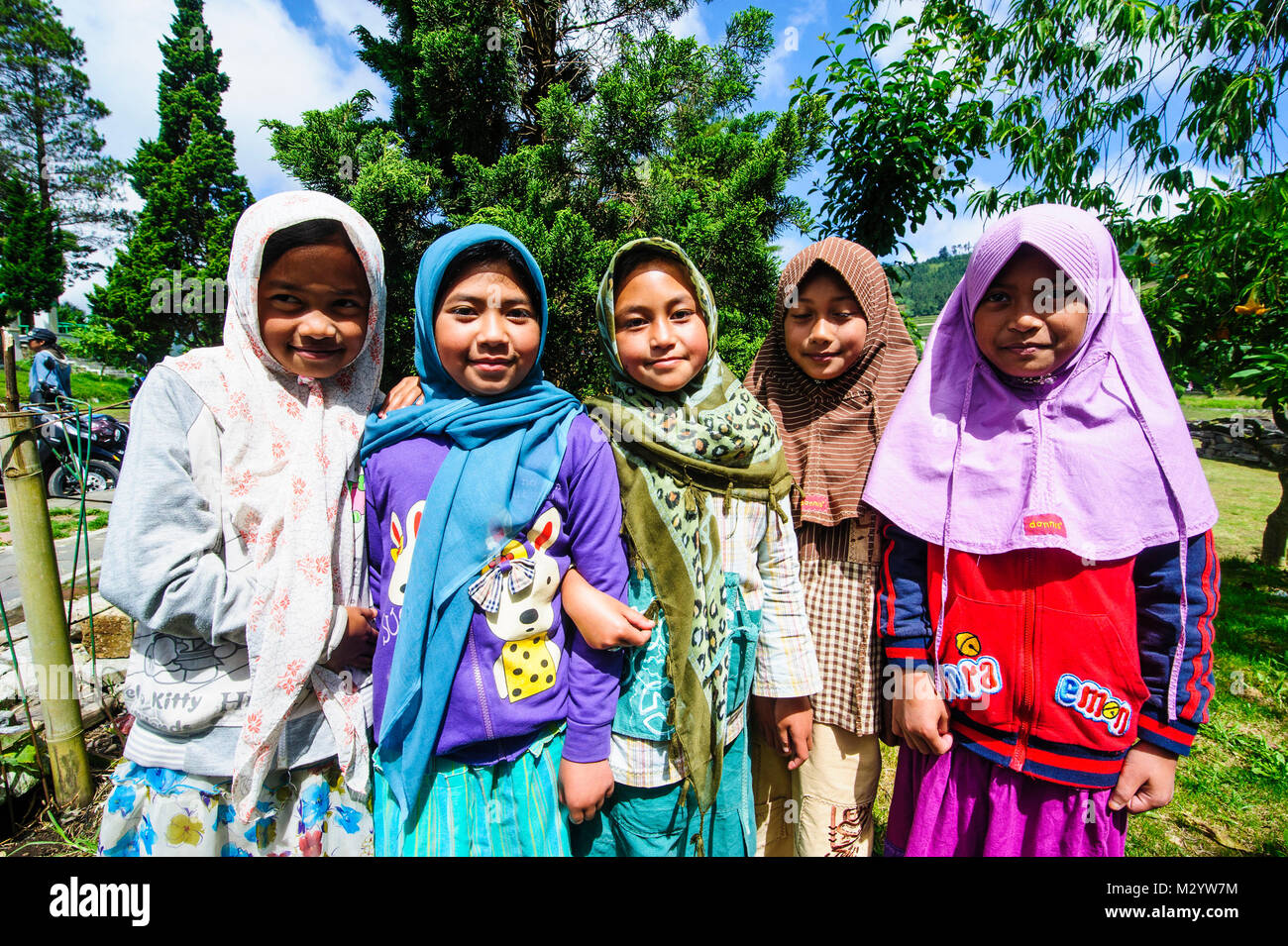 Young muslim girls at a temple festival in the Arjuna Hindu Dieng temple complex , Dieng Plateau, Java, Indonesia Stock Photo