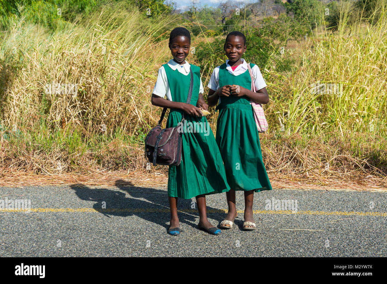 Young school girl on their way home, Cape Maclear, Malawi, Africa Stock Photo