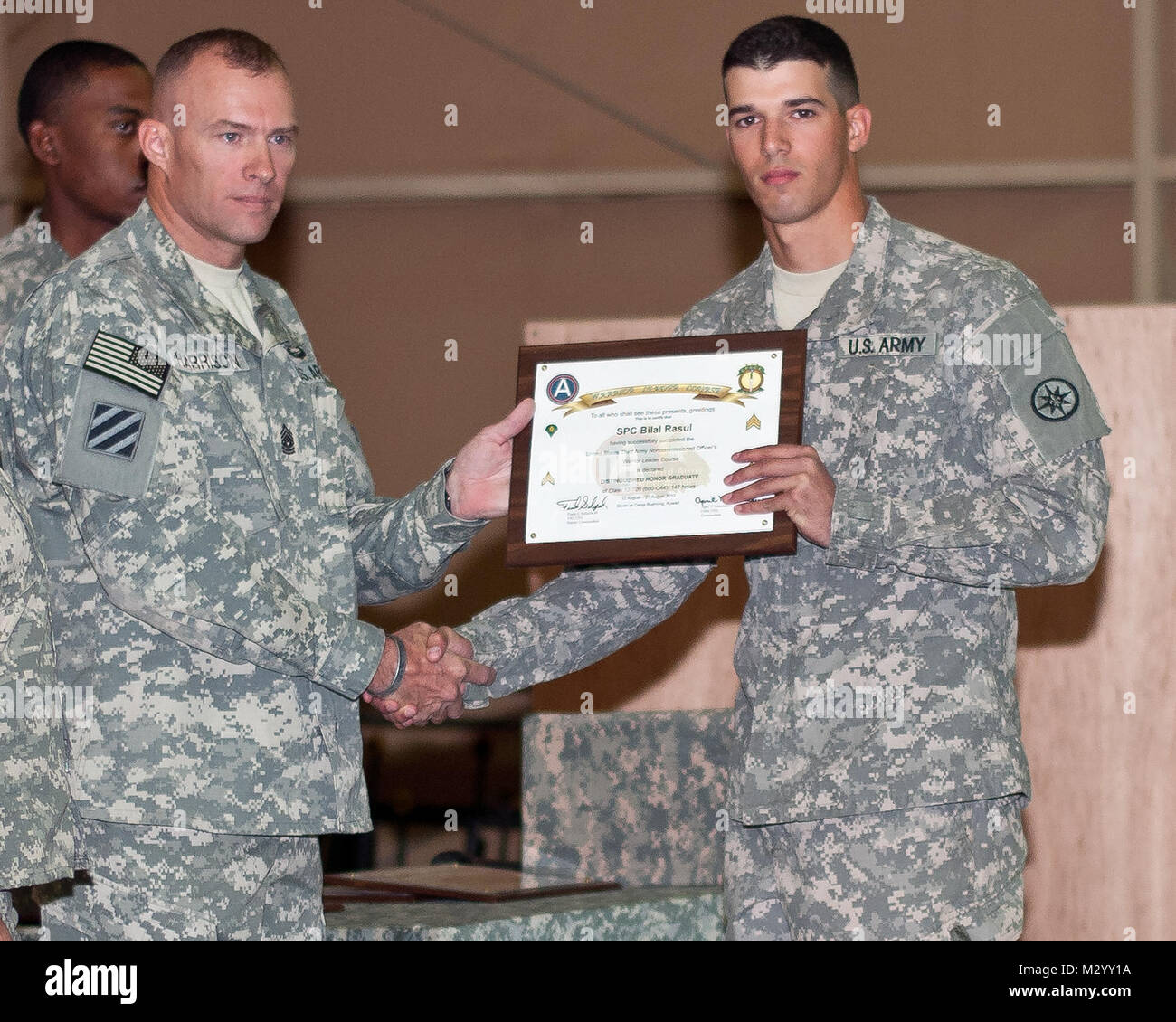 Spc. Bilal Rasul, a resident of Ravenna, Ohio, and a cook with the 316th Sustainment Command (Expeditionary), graduated from Warrior Leader Course, Class 12-709, at Camp Beuhring, Kuwait, Aug.27. Rasul was the Distinguished Honor Graduate of the class by earning over a 90%% on every testable assignment and having the overall highest average out of nearly 130 classmates. (U.S. Army Photo By Staff Sgt. Peter J. Berardi, 316th Sustainment Command (Expeditionary)) Distinguished Honor Graduate by 316th ESC Stock Photo