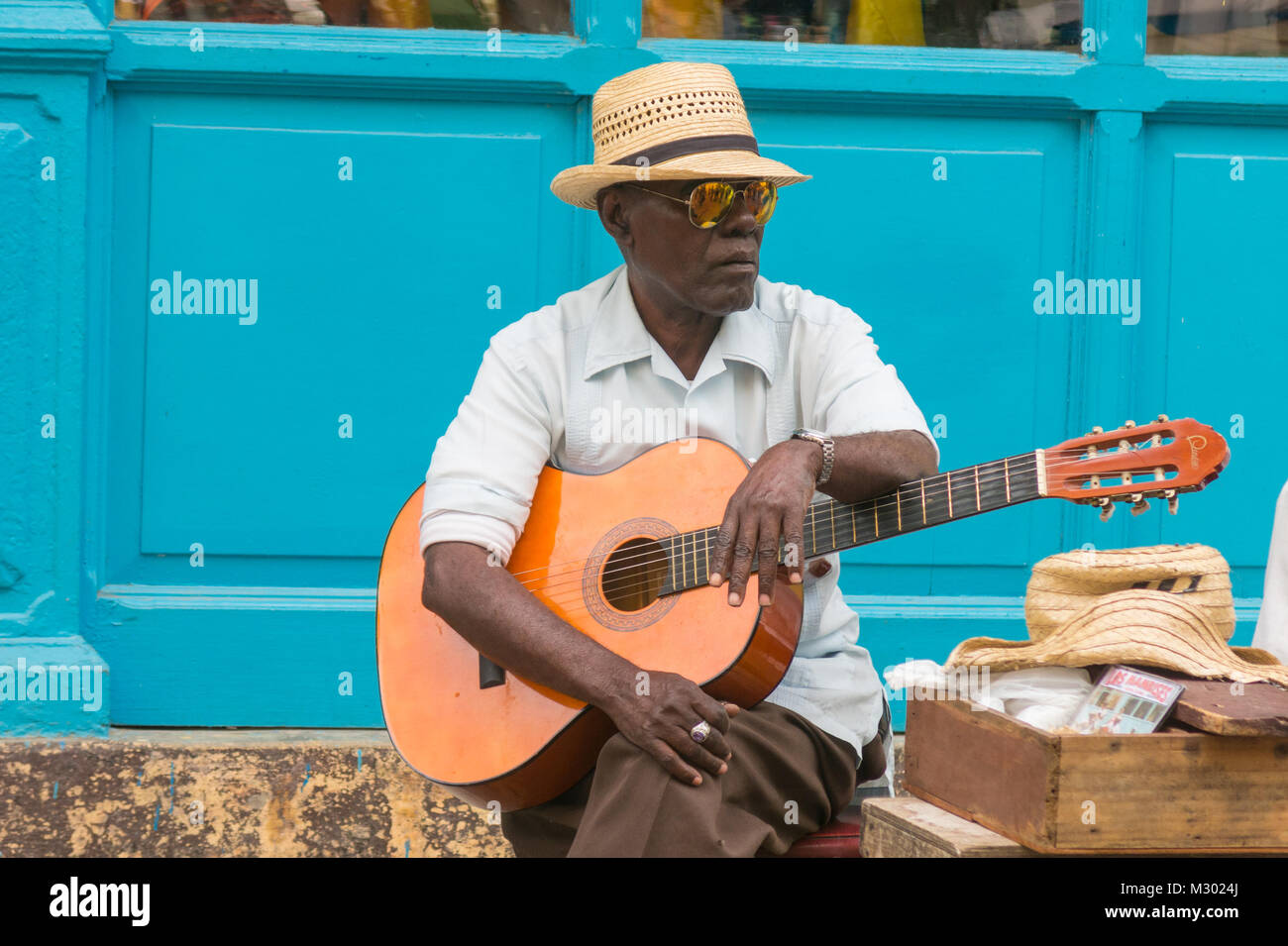 HAVANA, CUBA - JANUARY 16, 2017: Street musician perform for tourists and tips in Old Havana, Havana, Cuba Stock Photo