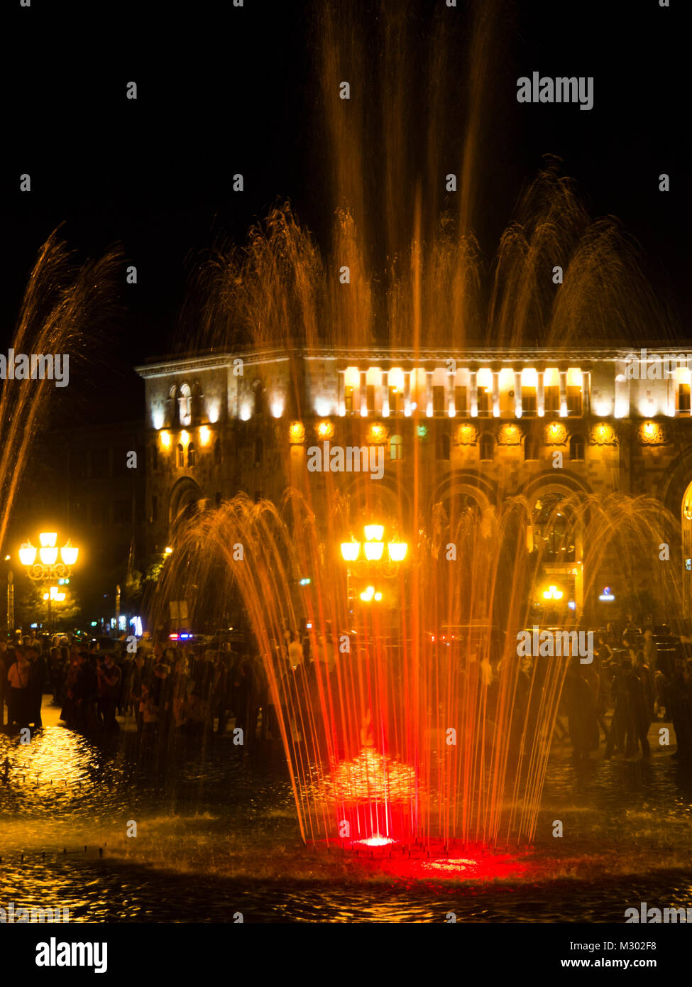The Republic Square in Yerevan Armenia at night features a musical fountain, also called dancing fountain with changing light and water features Stock Photo