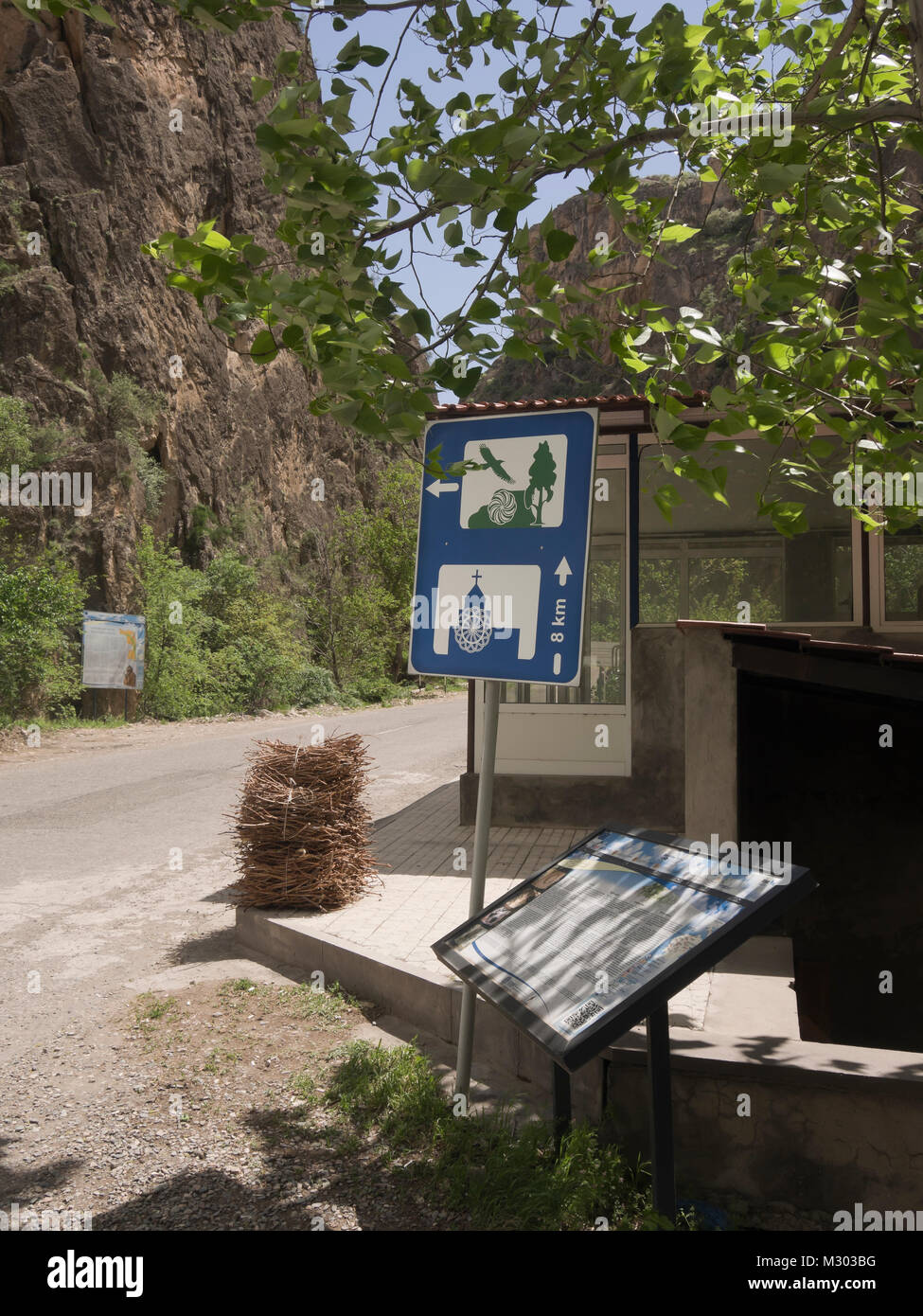 Pictorial traffic sign pointing to the cultural heritage Noravank monastery and the senic gorge with wildlife in the way in Stock Photo