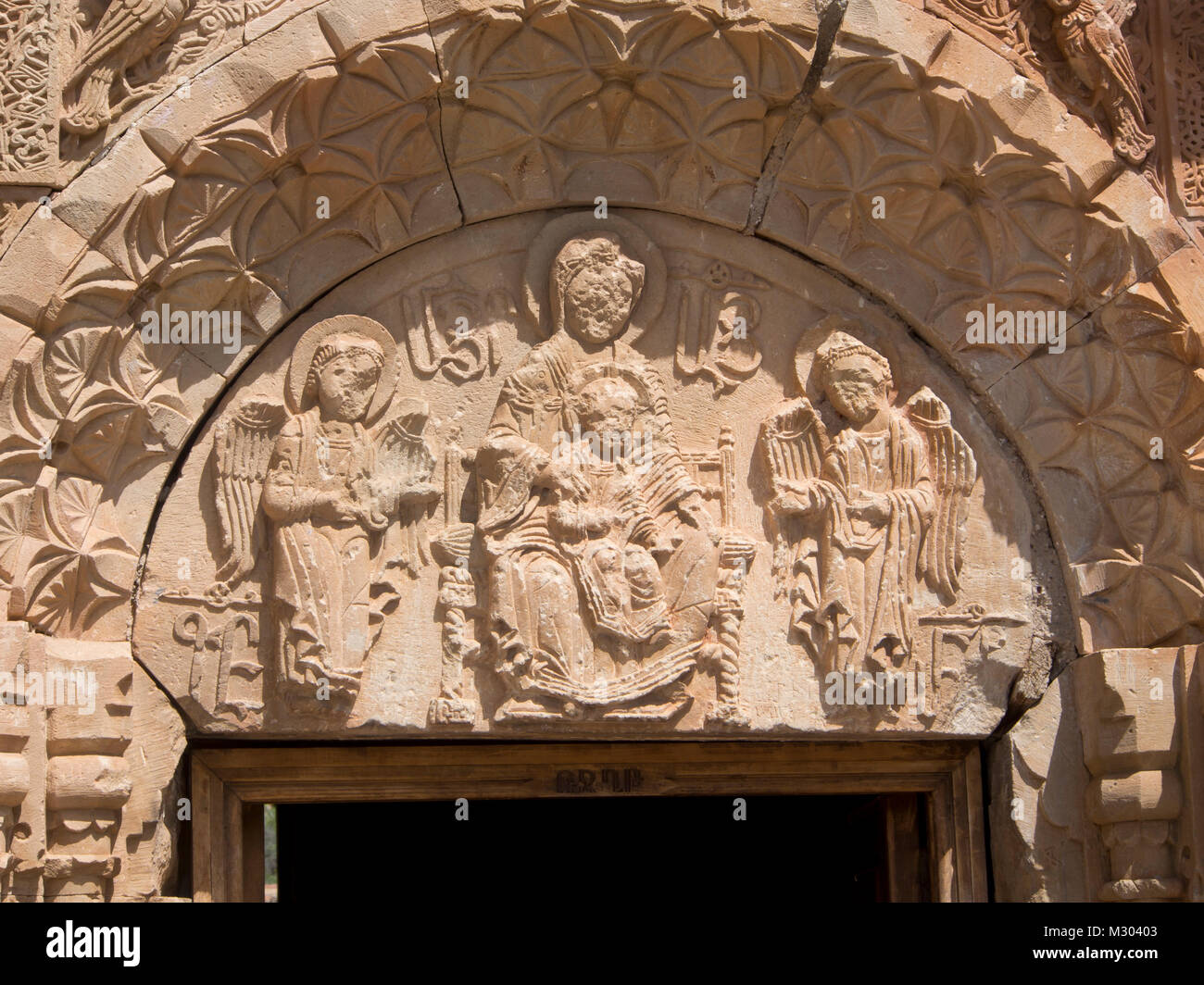 Noravank Monastery in southern Armenia,Surb Astvatsatsin Church,the lower tympanum showing the Holy Virgin with the Child Stock Photo