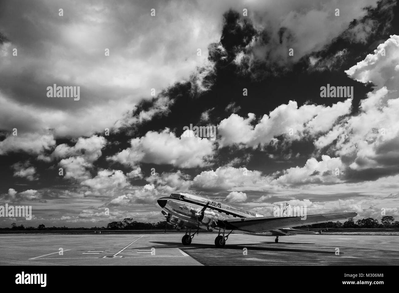 A Douglas DC-3 aircraft taxis on the runway before taking off at the airport of Villavicencio, Colombia. Stock Photo