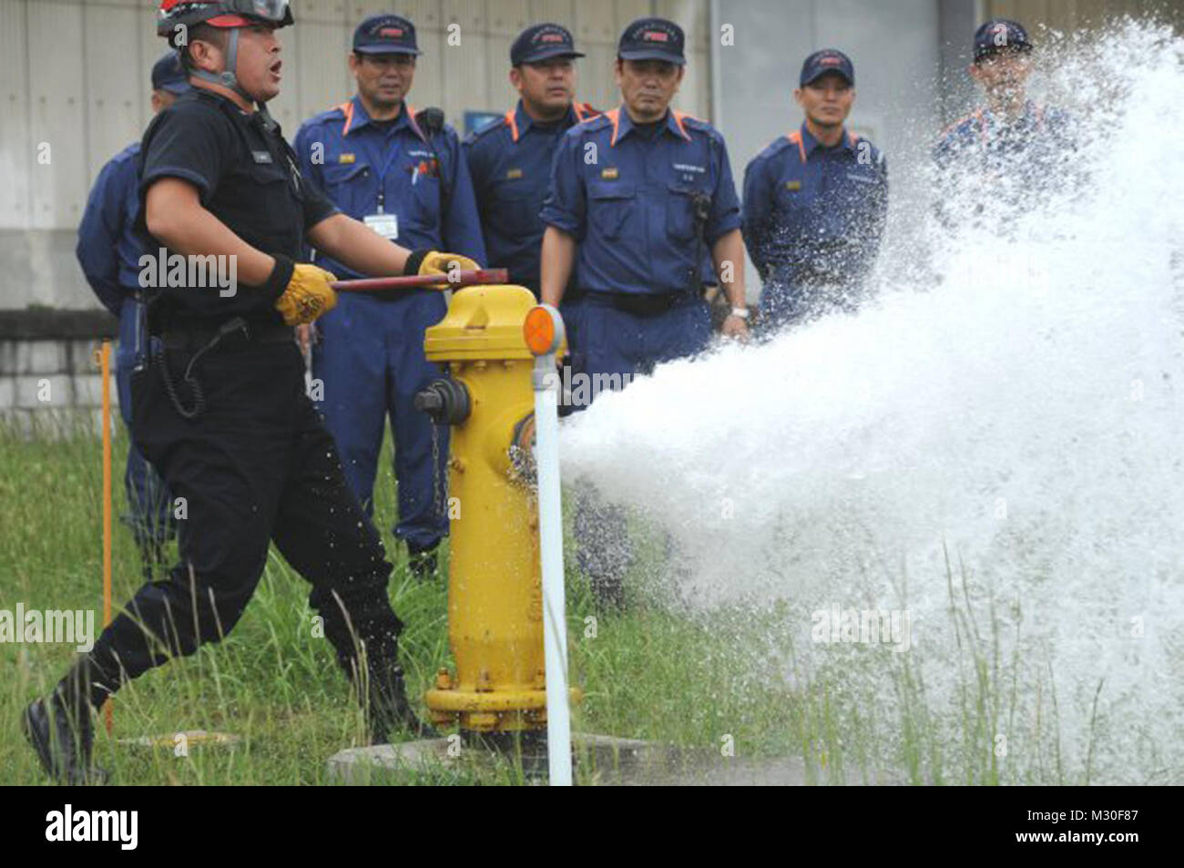 U.S. Army Garrison Japan Fire Department, demonstrates how to open a
