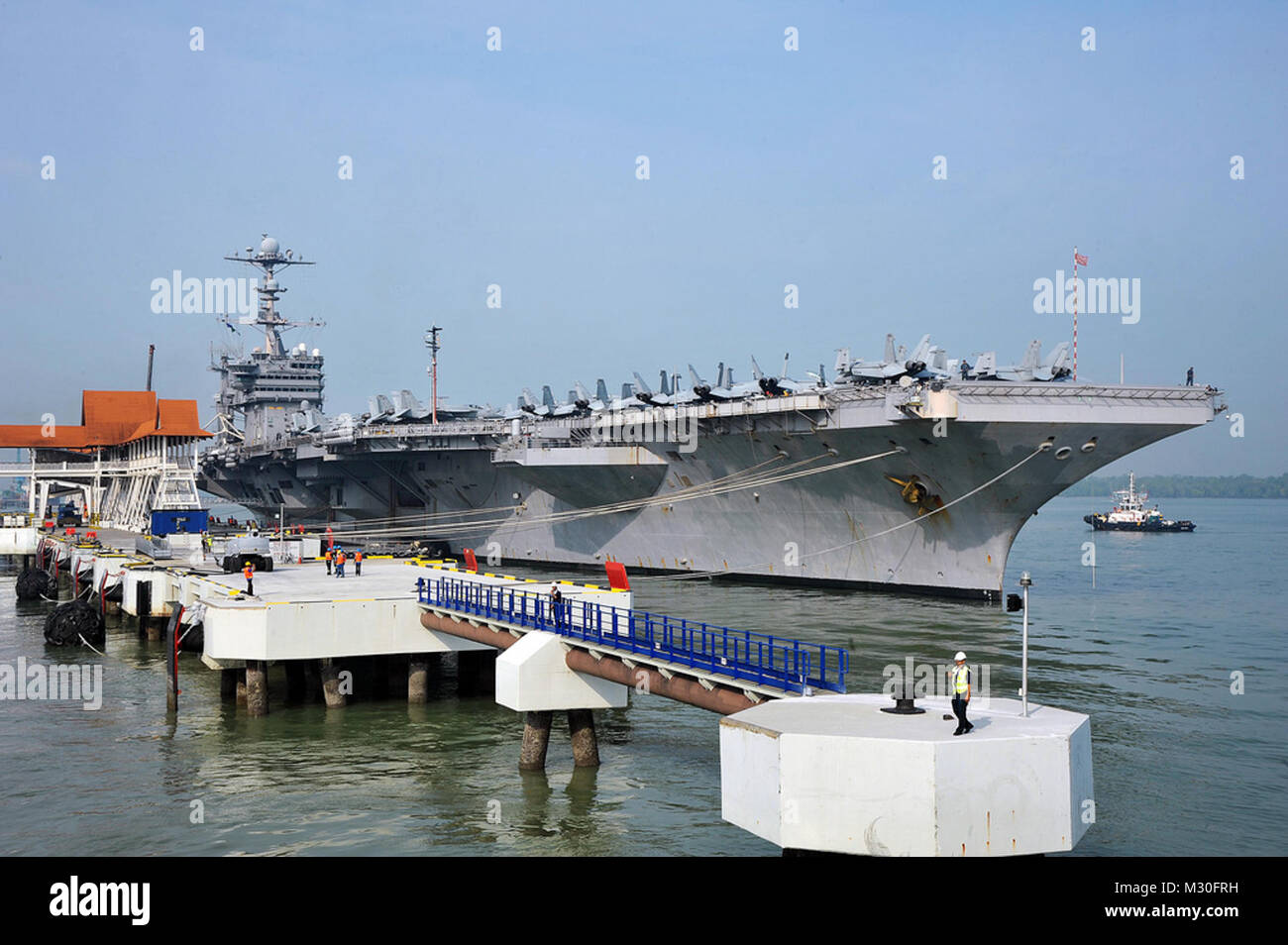 Aircraft Carrier Uss George Washington Sits At The Pier In Port Klang