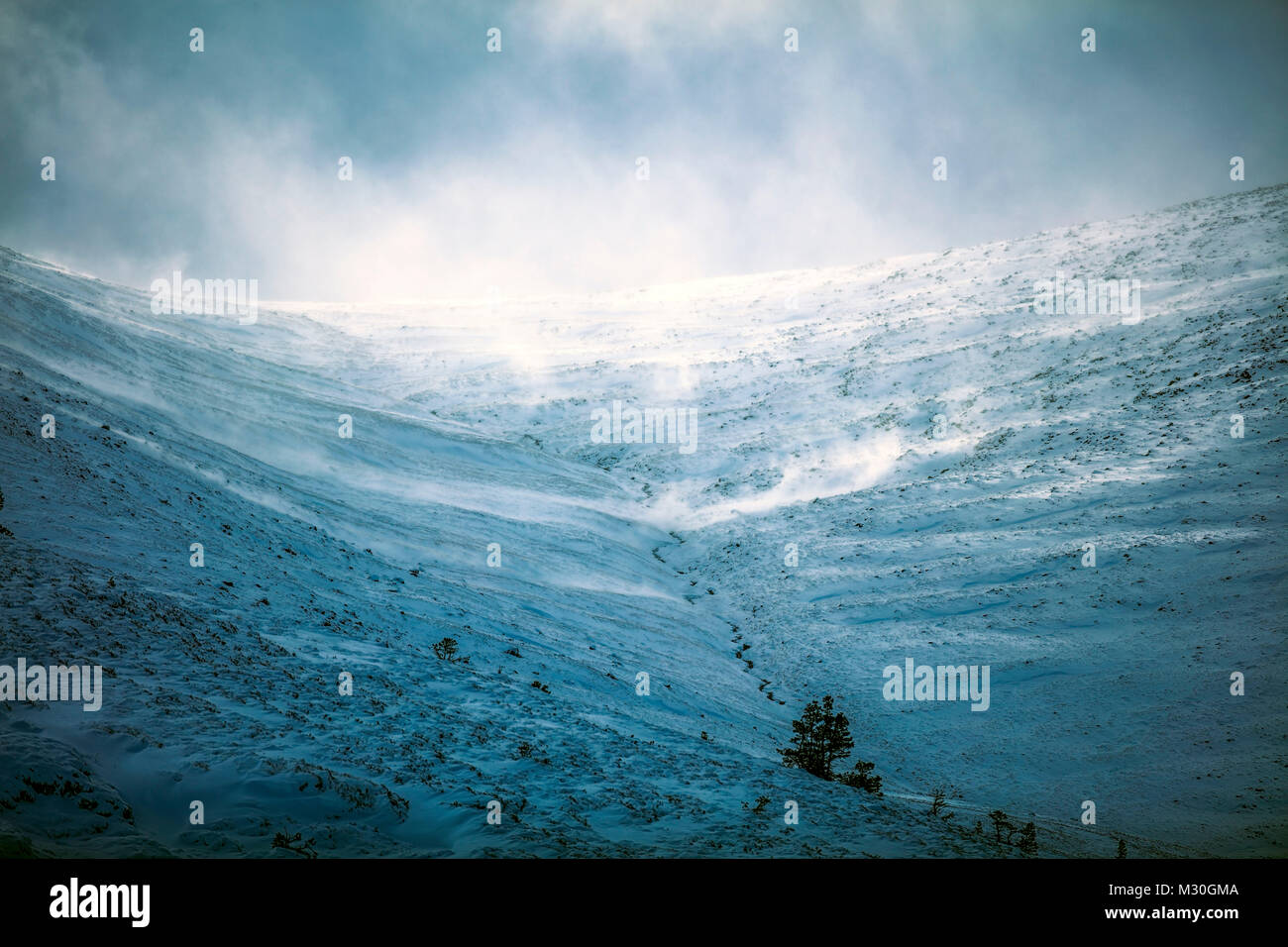 Snow storm, blowing snow on mountain in Scotland Stock Photo