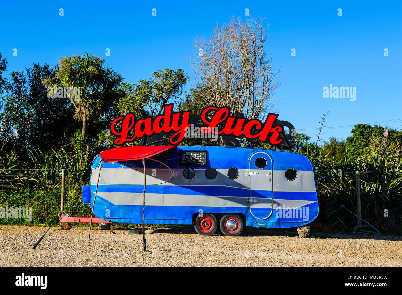 Colourful trailer as a snackstore, Aorere river, Collingwood, Golden Bay, South Island, New Zealand Stock Photo