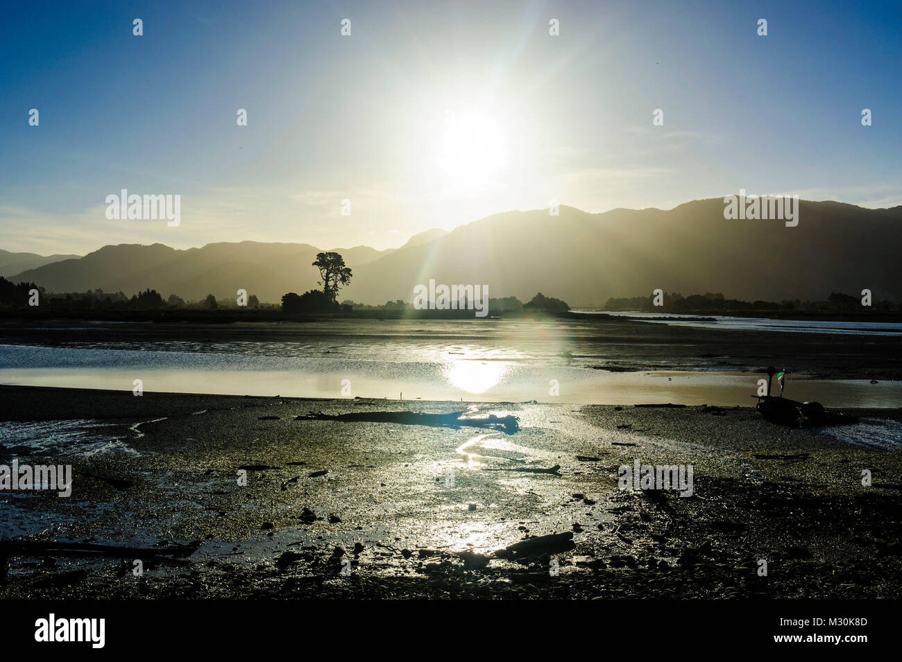 Backlight over the Aorere river, Collingwood, Golden Bay, South Island