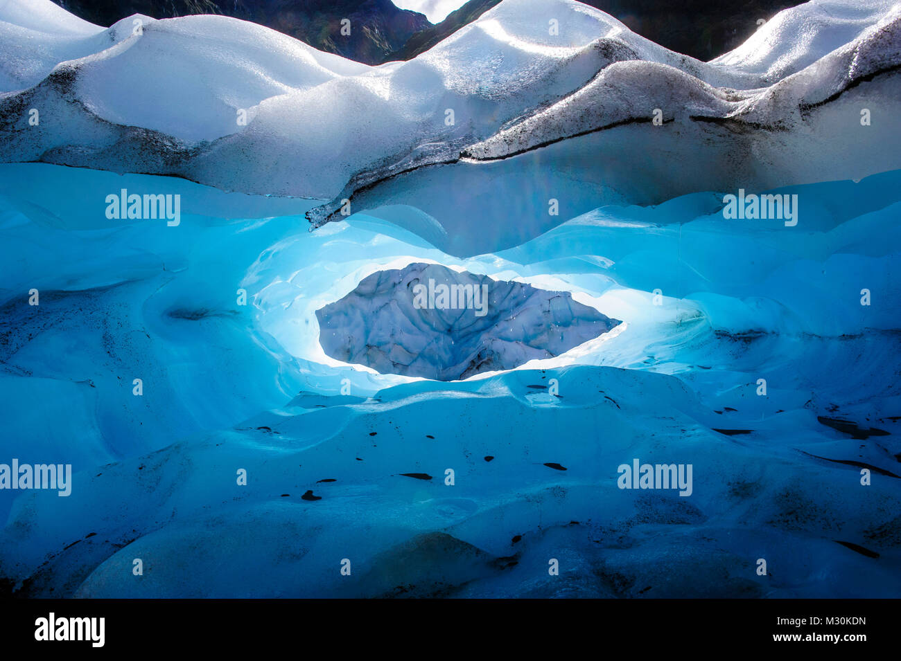 Very bluie ice in an Ice cave in the Fox Glacier, South Island, New ...