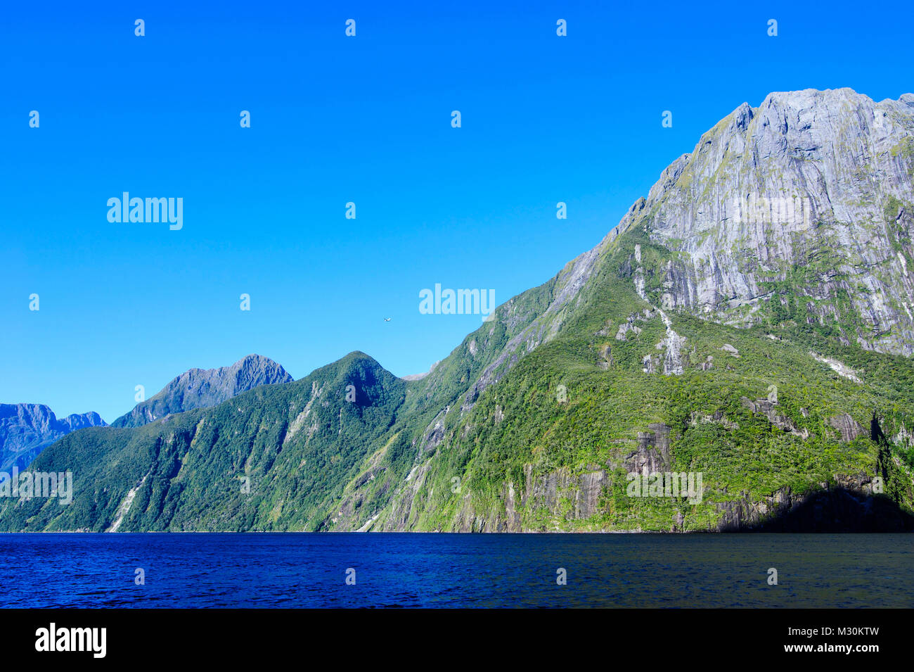 The steep cliffs of Milford Sound, South Island, New Zealand Stock ...