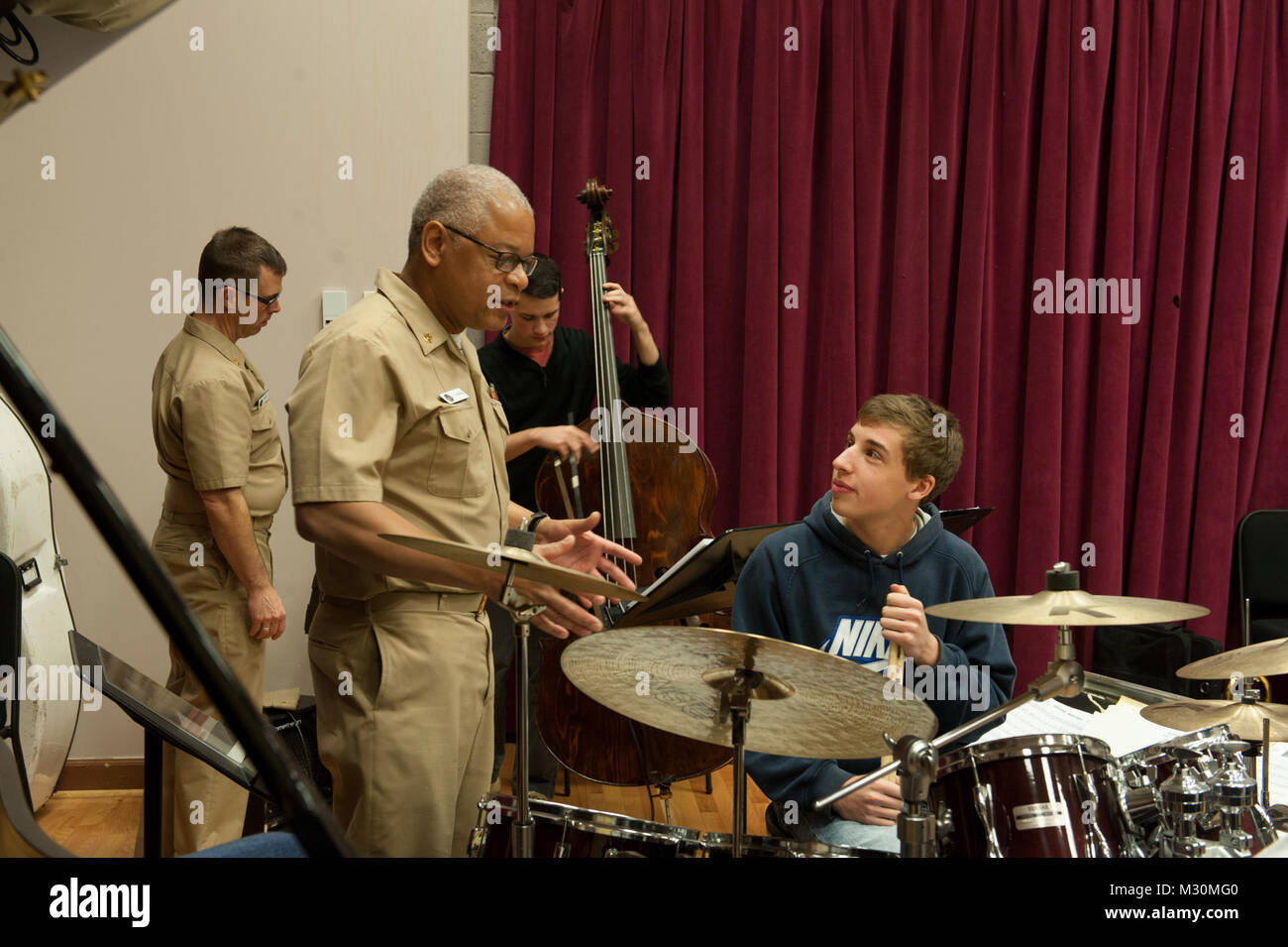 121129-N-HG258-018 WASHINGTON, DC (November 29, 2012)  Chief Musician John Parsons, left, a member of the Navy Band Commodores, discusses drumming techniques to a student from Walt Whitman High School during a visit to the Commodores rehearsal at the Historic Washington Navy Yard in Washington, D.C. The Navy Band presents clinics for local high schools around the Washington, D.C., area as part of their music in the schools program designed to supplement music education curricula and build bridges between the Navy and younger generations. Walt Whitman High School visits Commodores by United Sta Stock Photo