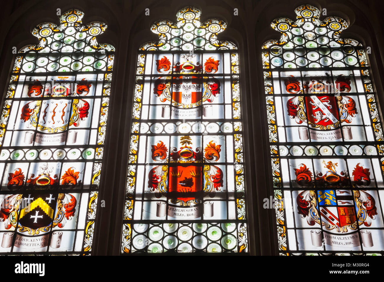 England, London, The City, King's College, The Maughan Library, The Weston Room, Stained Glass Window depicting The Coats of Arms of Previous Masters of the Rolls Stock Photo