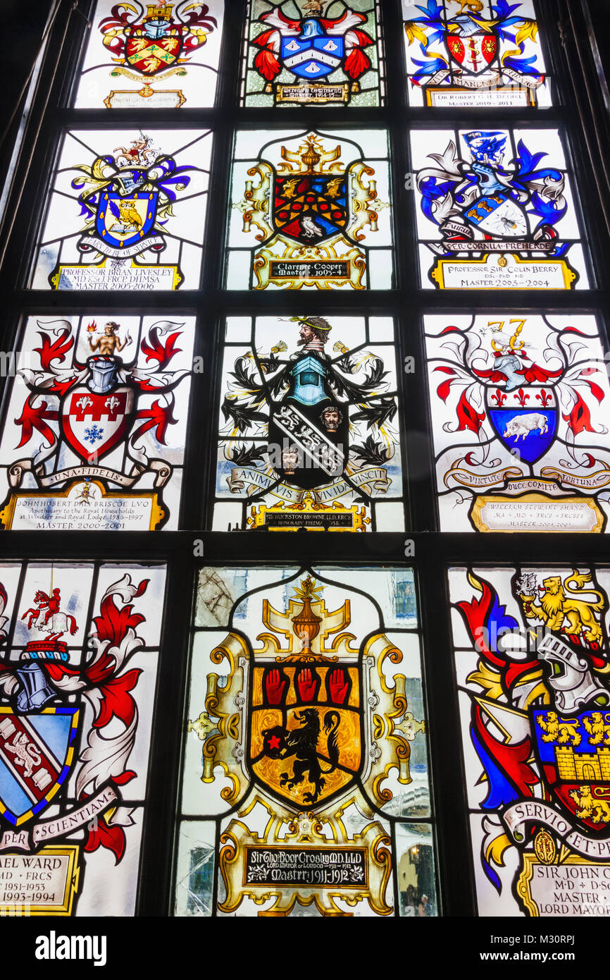 England, London, The City, Black Friars Lane, Apothecaries' Hall, The Great Hall, Stained Glass Window depicting Coats of Arms of Former Masters Stock Photo