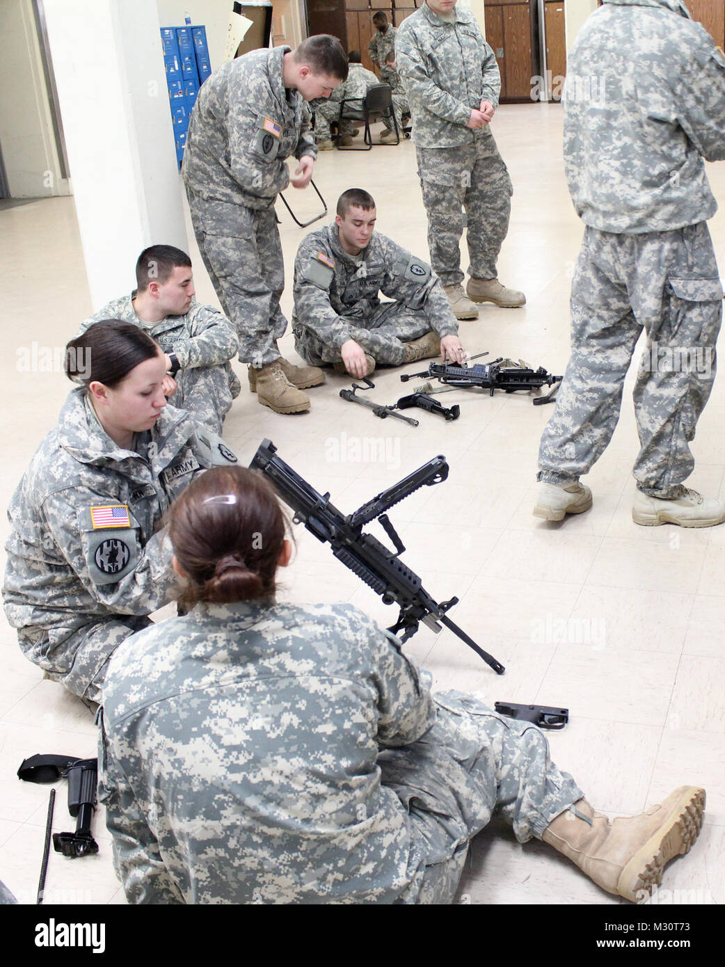 Military Police with the 1st Stryker Brigade Combat Team, 25th Infantry  Division, clean and conduct remedial training with the M249 light machine  gun in preparation for the firing range at Fort Wainwright,