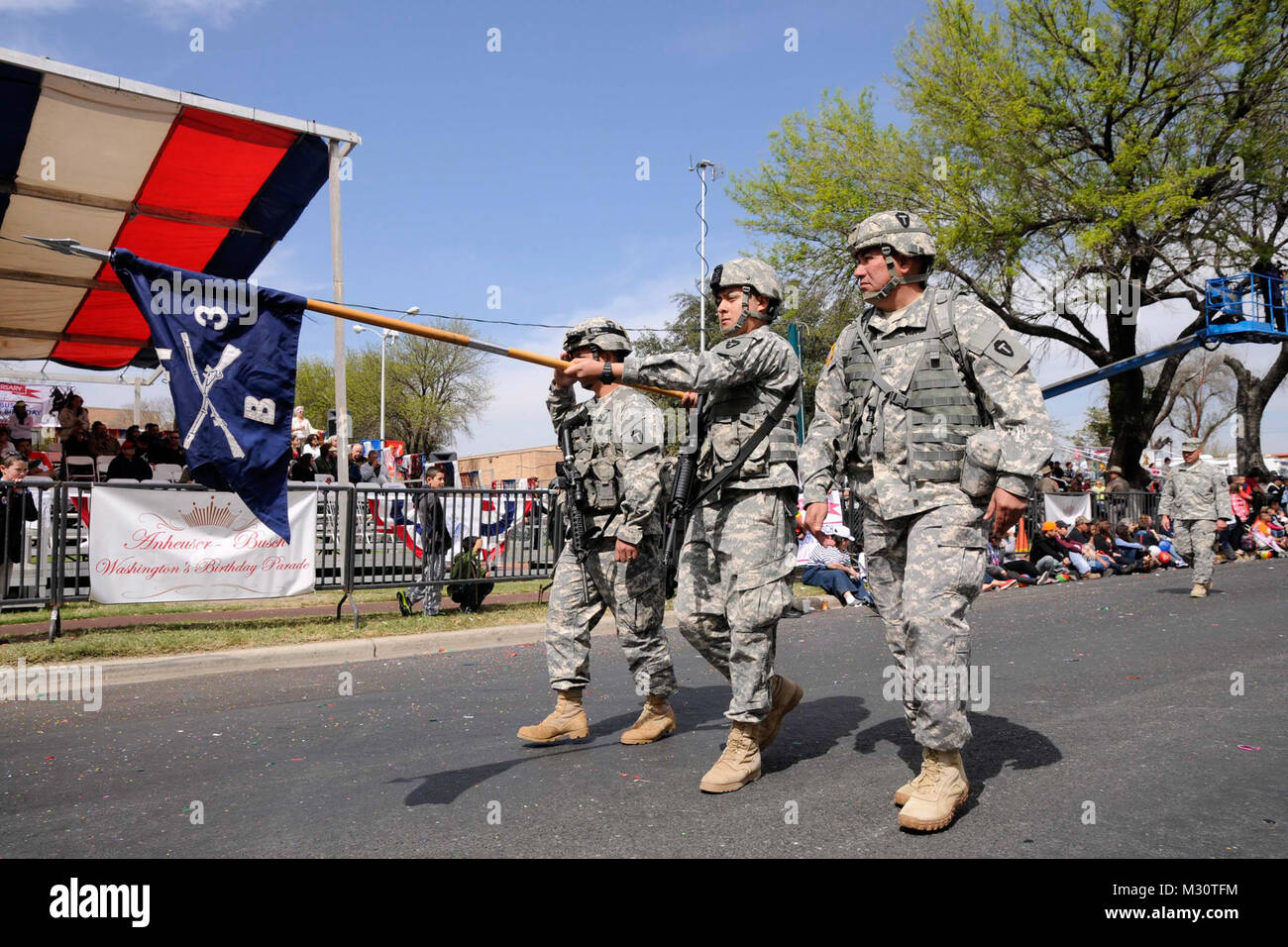 Soldiers from 3rd Battalion, 141st Infantry Regiment, Texas Army National Guard, participate at the 2013 George Washington Birthday Celebration Parade in Laredo, TX, Feb. 23, 2013. The event is part of a two-week long celebration, recognizing the former president. (National Guard photo by Army Staff Sgt. Malcolm McClendon). Texas Military Forces participate in George Washington Birthday Celebration by Texas Military Department Stock Photo
