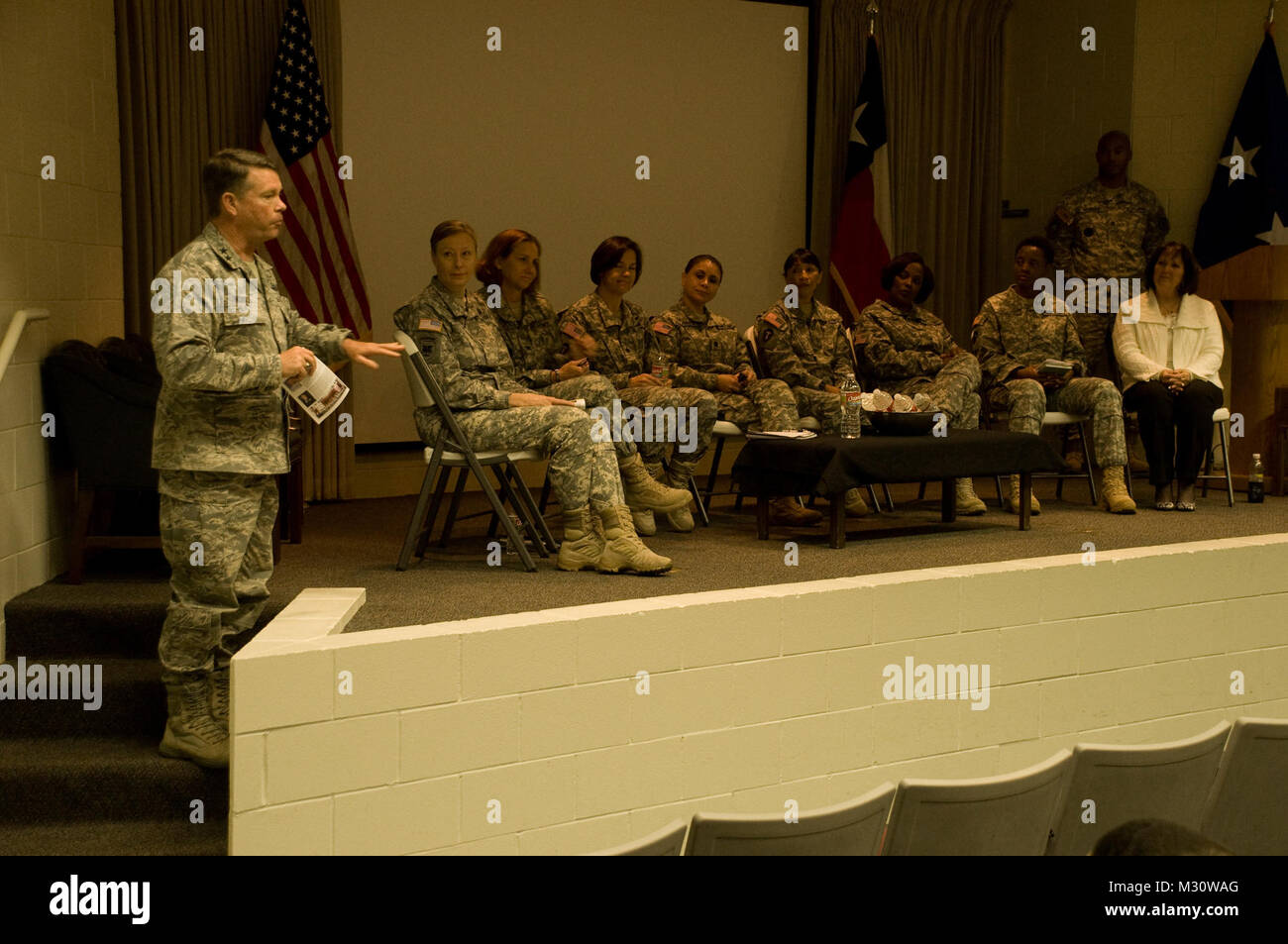 Maj. Gen. John F. Nichols, Texas Adjutant General speaks to assembled Texas Military Forces service members after the Senior Women in Leadership roundtable during the 2013 Adjutant General’s observance of Women’s History Month on March 26, 2013.  From left to right- Brig. Gen. Joyce L. Stevens, the Assistant Adjutant General-Army for the state of Texas, Col. Suzanne D. Adkinson, Commander of the Texas Counterdrug Task Force, Lt. Col. Joanne E. MacGregor, Deputy Director of Government Affairs, Lt. Col. Alba M Villanueva, branch manager for Family Support Services, Chief Warrant Officer 4 Arsili Stock Photo