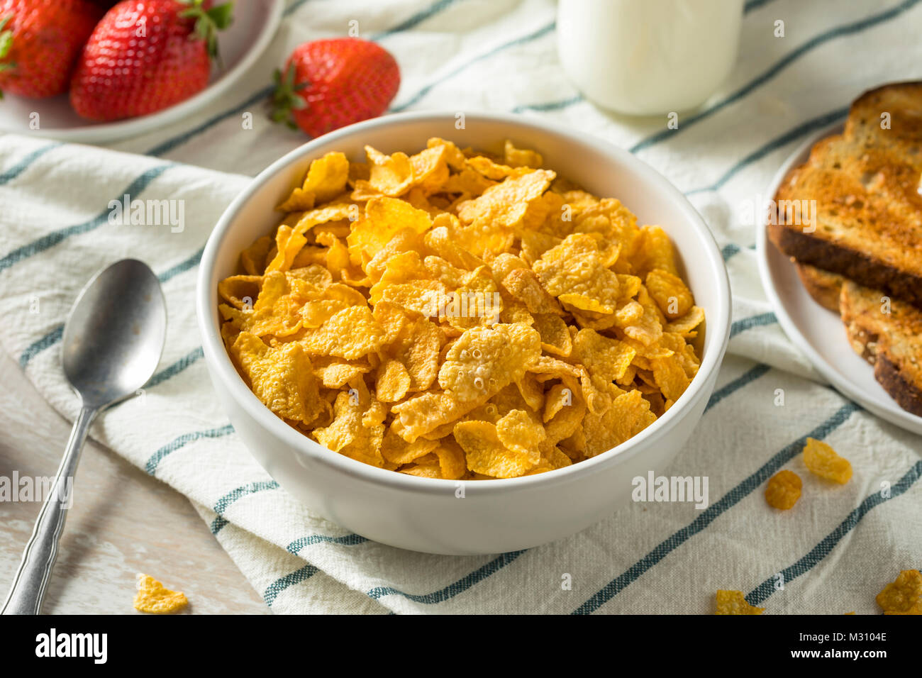 Healthy Corn Flakes with Milk for Breakfast with Fruit Stock Photo