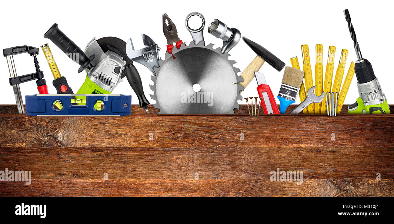 DIY tools collage concept behind wooden plank with copy space and circular saw blade isolated on white wide panorama background Stock Photo