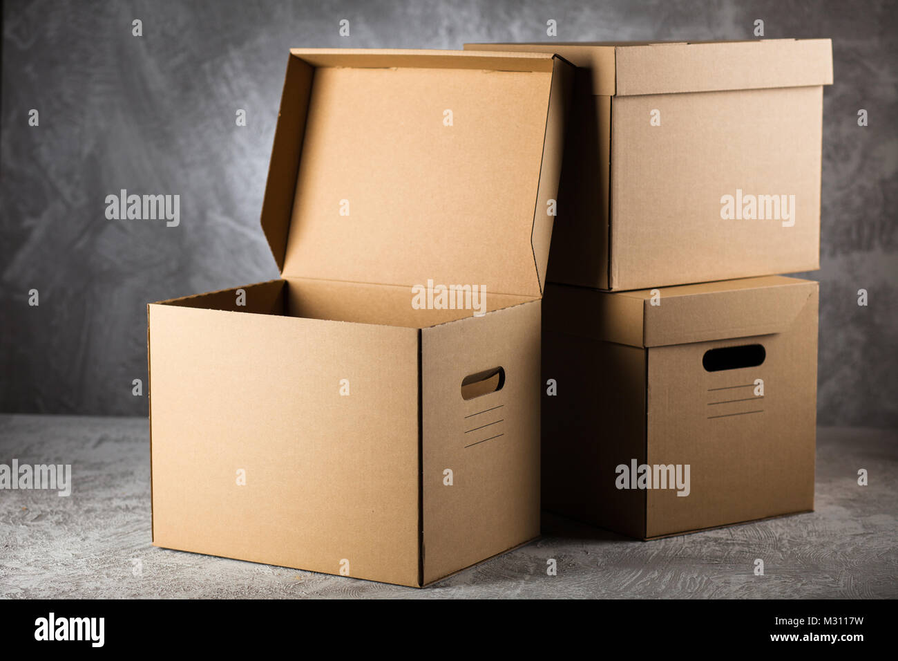 Cardboard box on grey background Stock Photo