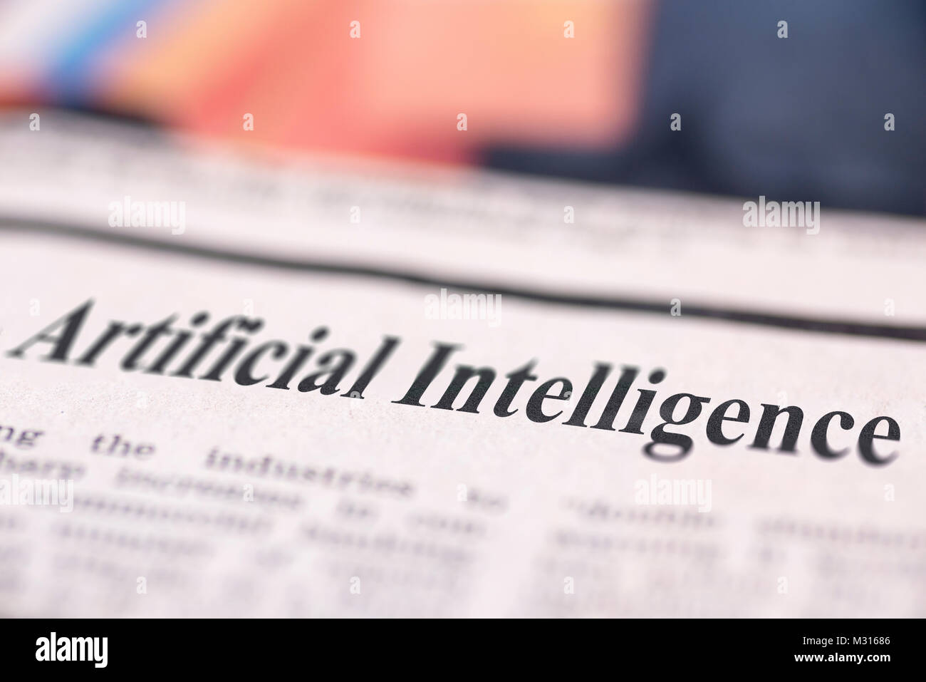 Artificial Intelligence written newspaper close up shot to the text. Stock Photo