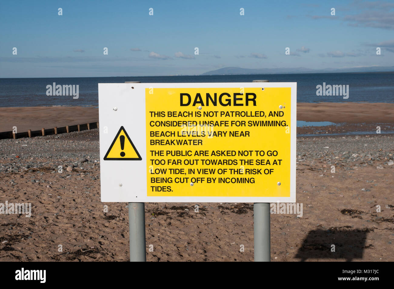 Warning sign on beach Stock Photo - Alamy