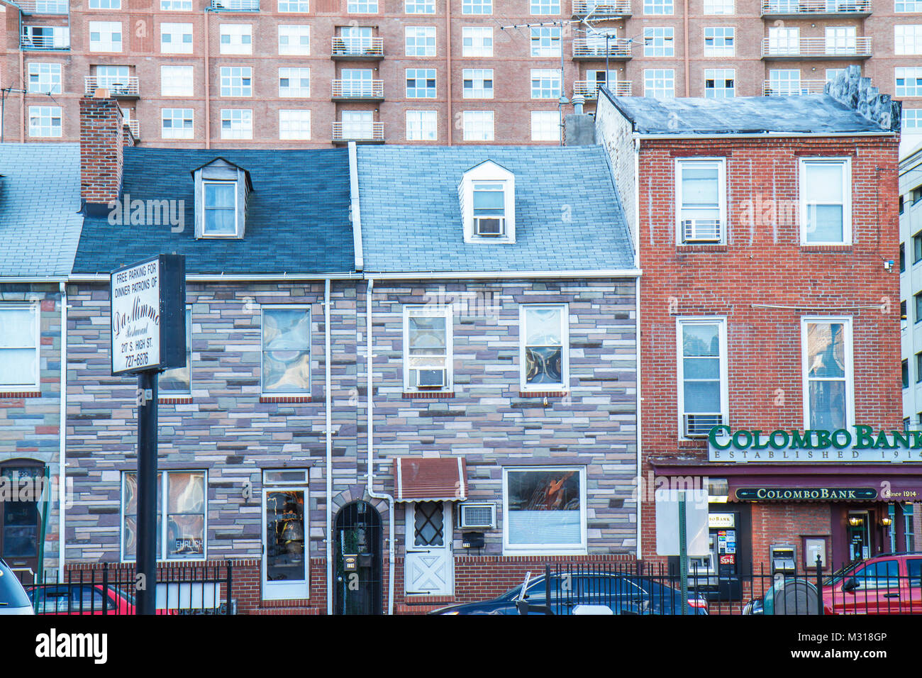 Baltimore Maryland,Little Italy neighborhood,row house,brick,Formstone,mixed use,Colombo Bank,banking,contrast,high rise skyscraper skyscrapers buildi Stock Photo