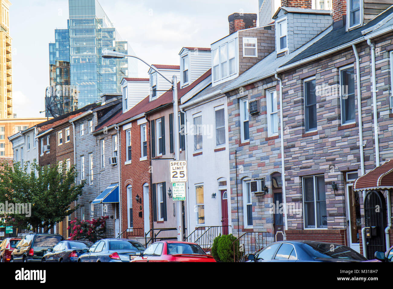 Baltimore Maryland,Little Italy,ethnic neighborhood,row house houses,brick,Formstone,contrast,high rise skyscraper skyscrapers building buildings traf Stock Photo