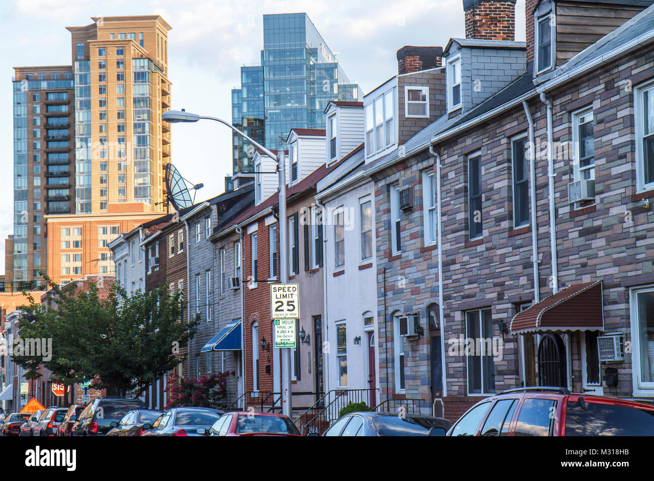 Baltimore Maryland,Little Italy neighborhood,row house,brick,Formstone,contrast,high rise skyscraper skyscrapers building buildings traffic,road,sign, Stock Photo