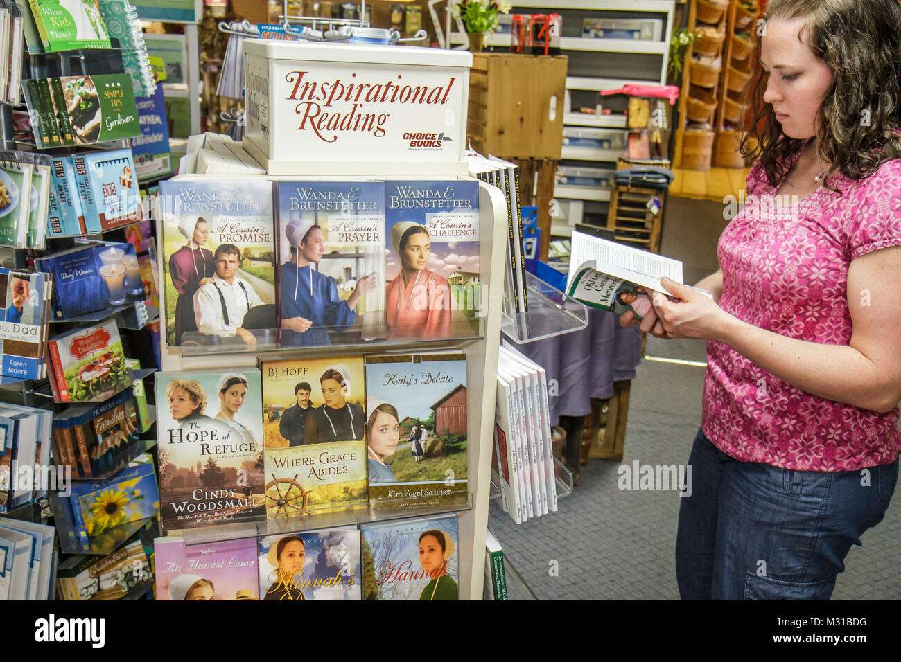 Pennsylvania,PA,Northeastern,Strasburg,Dutch Country,Hershey Farm,country store,gift shop,woman female women,young adult,book,books,paperback,Indiana Stock Photo